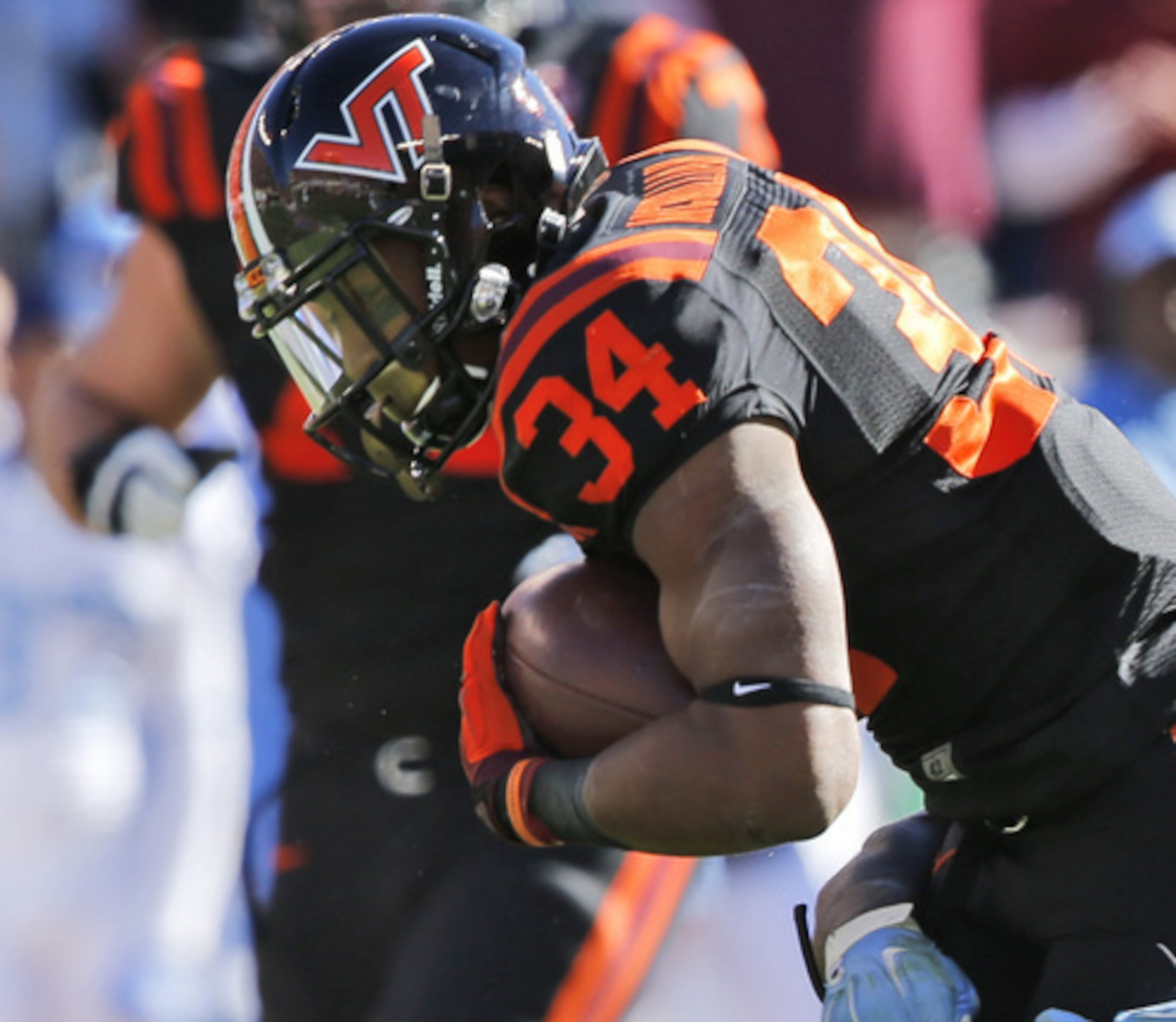 Travon McMillian breaks a tackle vs. North Carolina in a late November matchup
