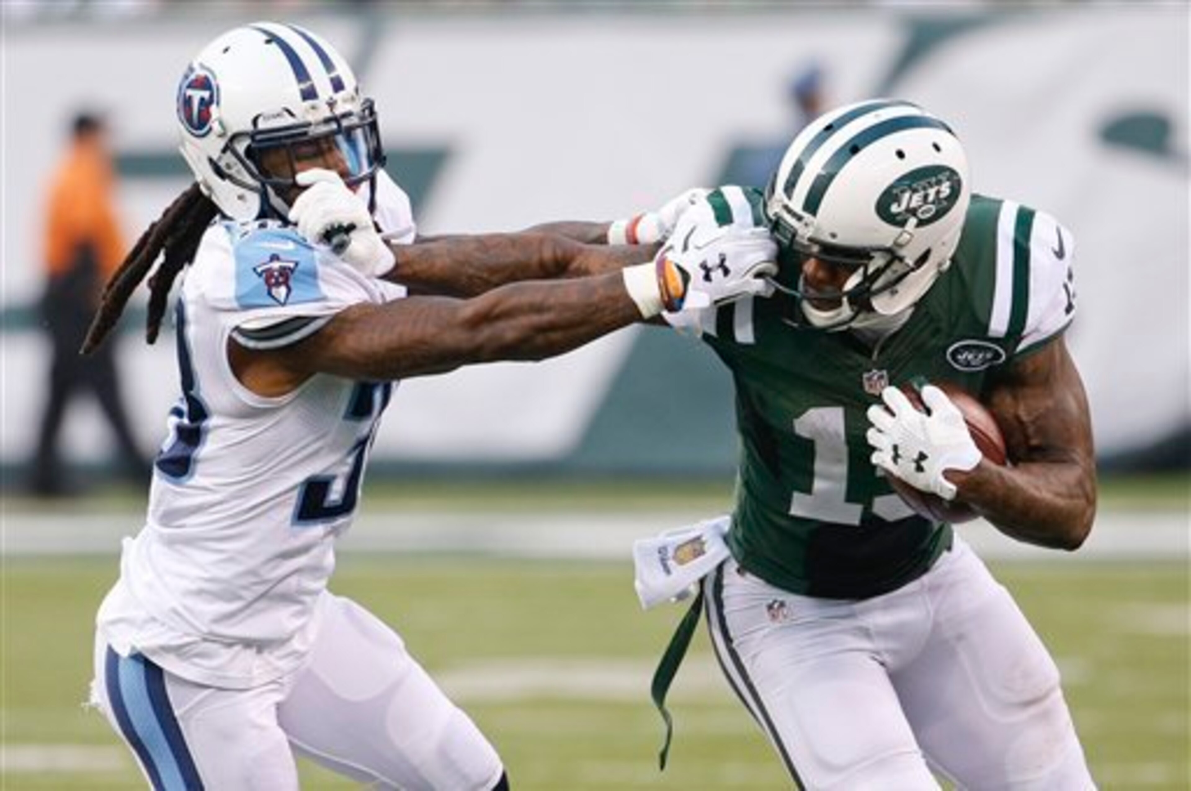 Brandon Marshall fights for extra yards against the Titans.