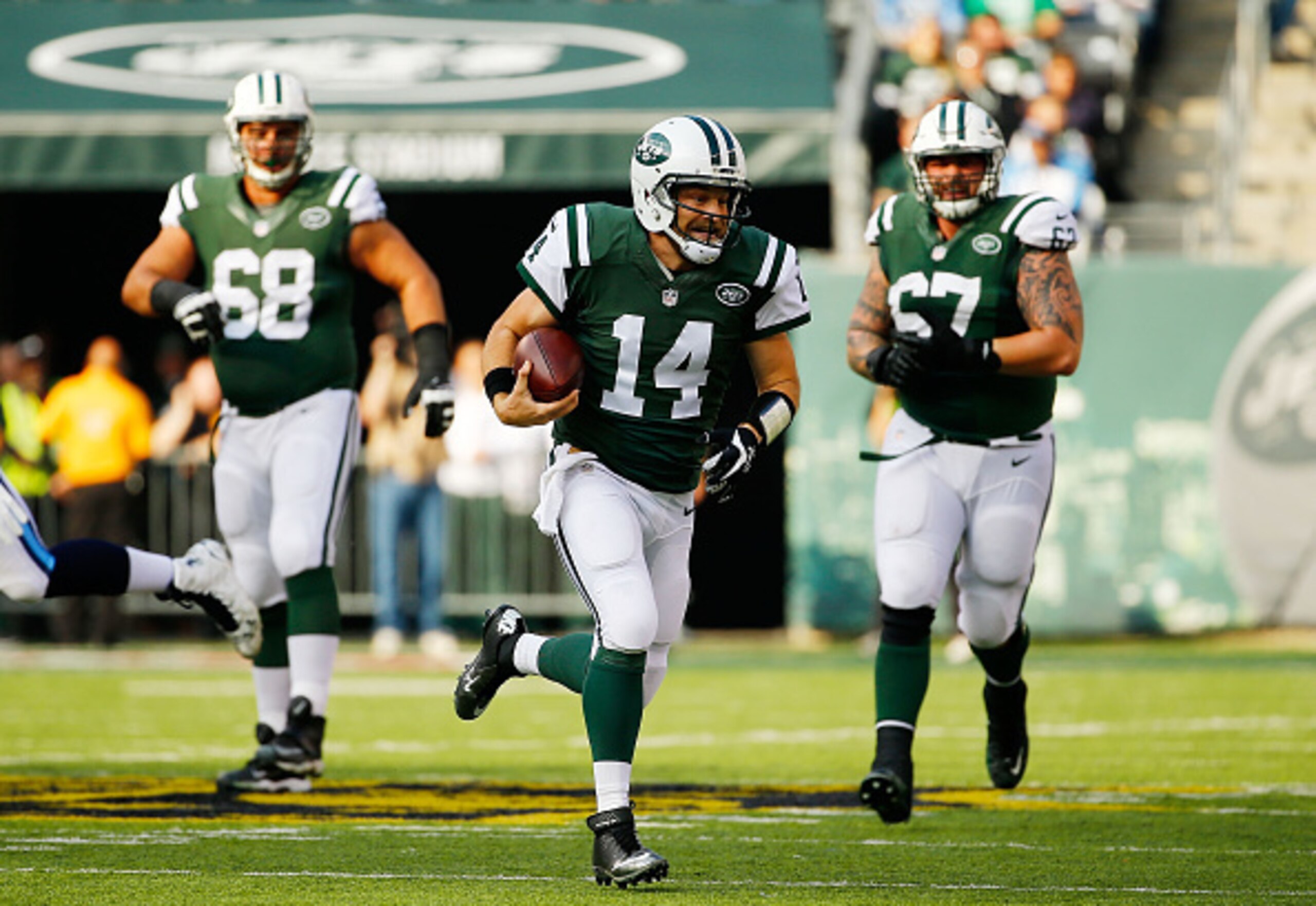 Ryan Fitzpatrick runs for a first down for the Jets.