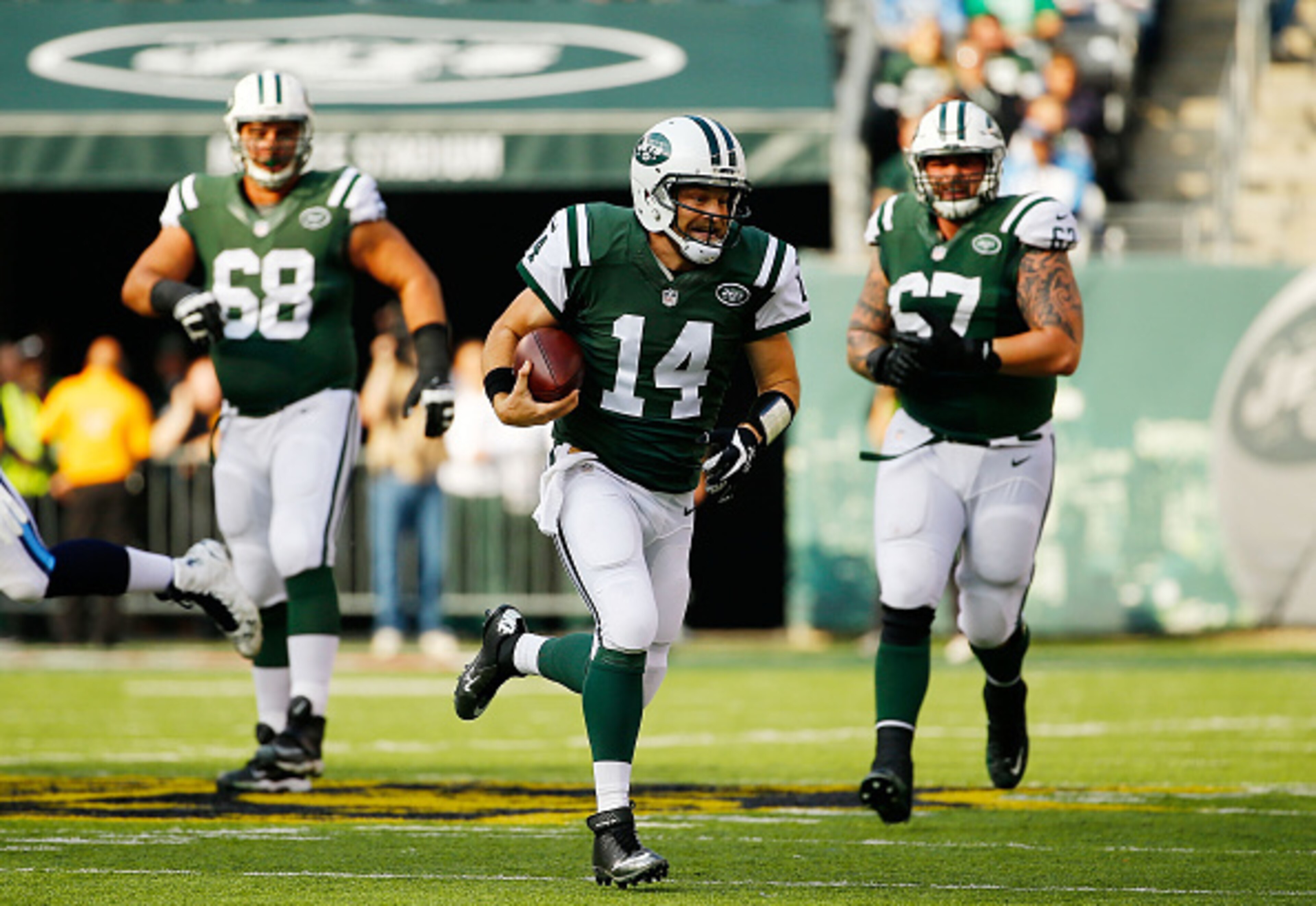 Ryan Fitzpatrick runs for a first down for the Jets.