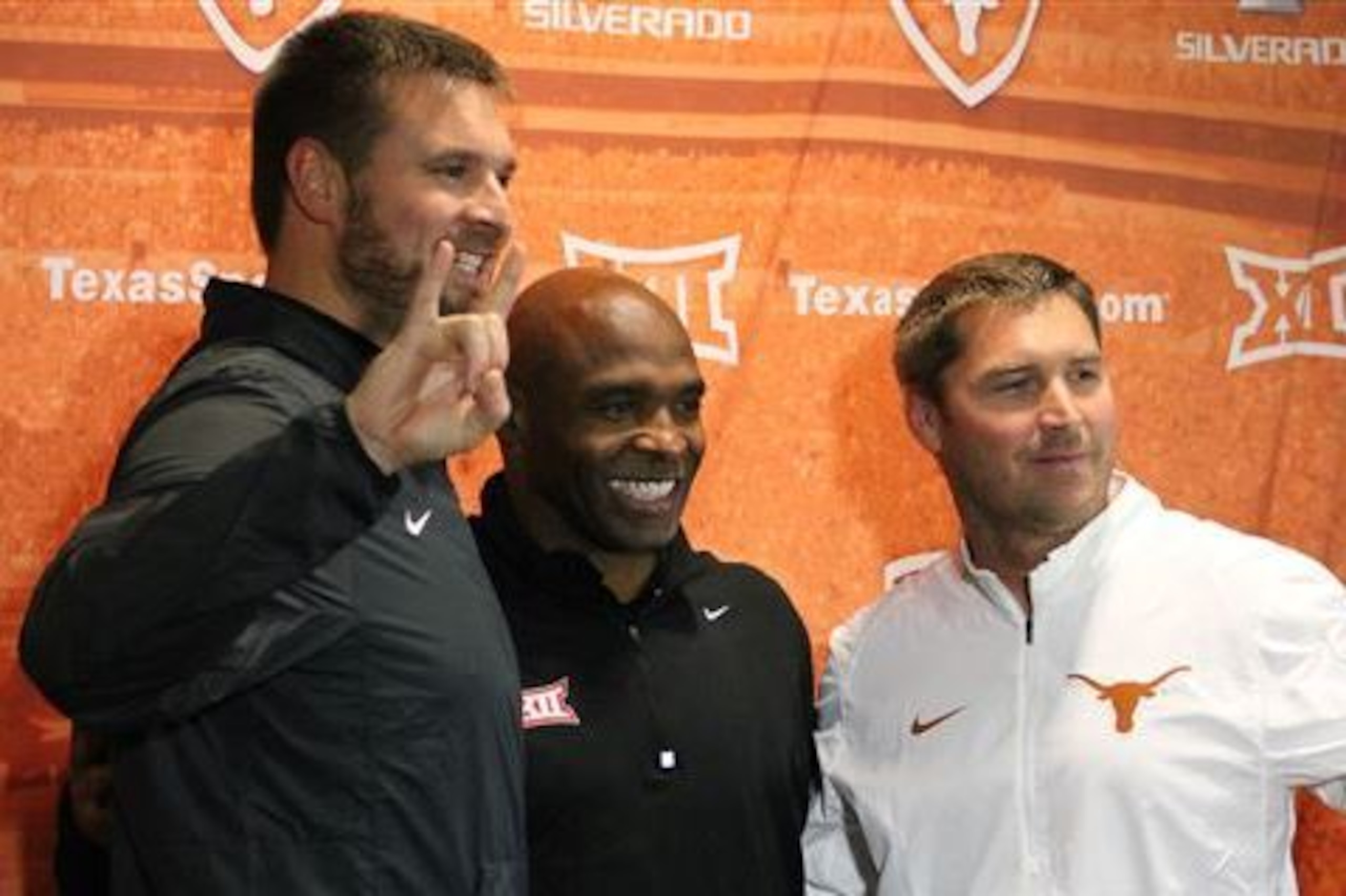 Sterlin Gilbert (right) will be Charlie Strong's (center) new offensive coordinator at Texas.