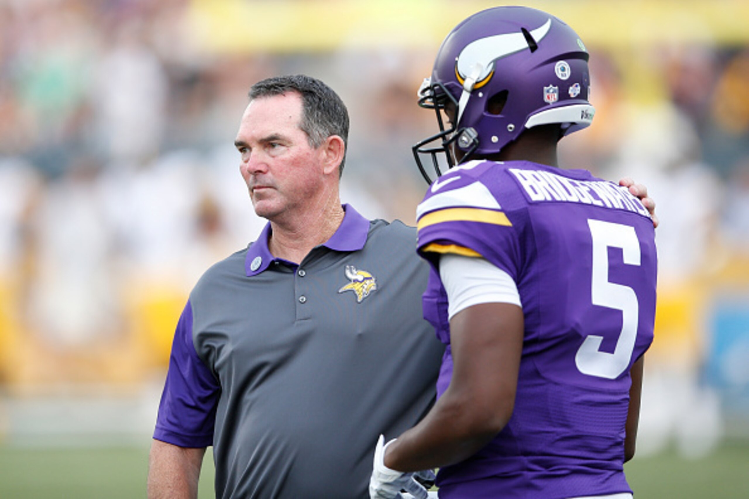 CANTON, OH - AUGUST 9: Head coach Mike Zimmer of the Minnesota Vikings talks with quarterback Teddy Bridgewater #5 during the NFL Hall of Fame Game against the Pittsburgh Steelers at Tom Benson Hall of Fame Stadium on August 9, 2015 in Canton, Ohio. (Phot
