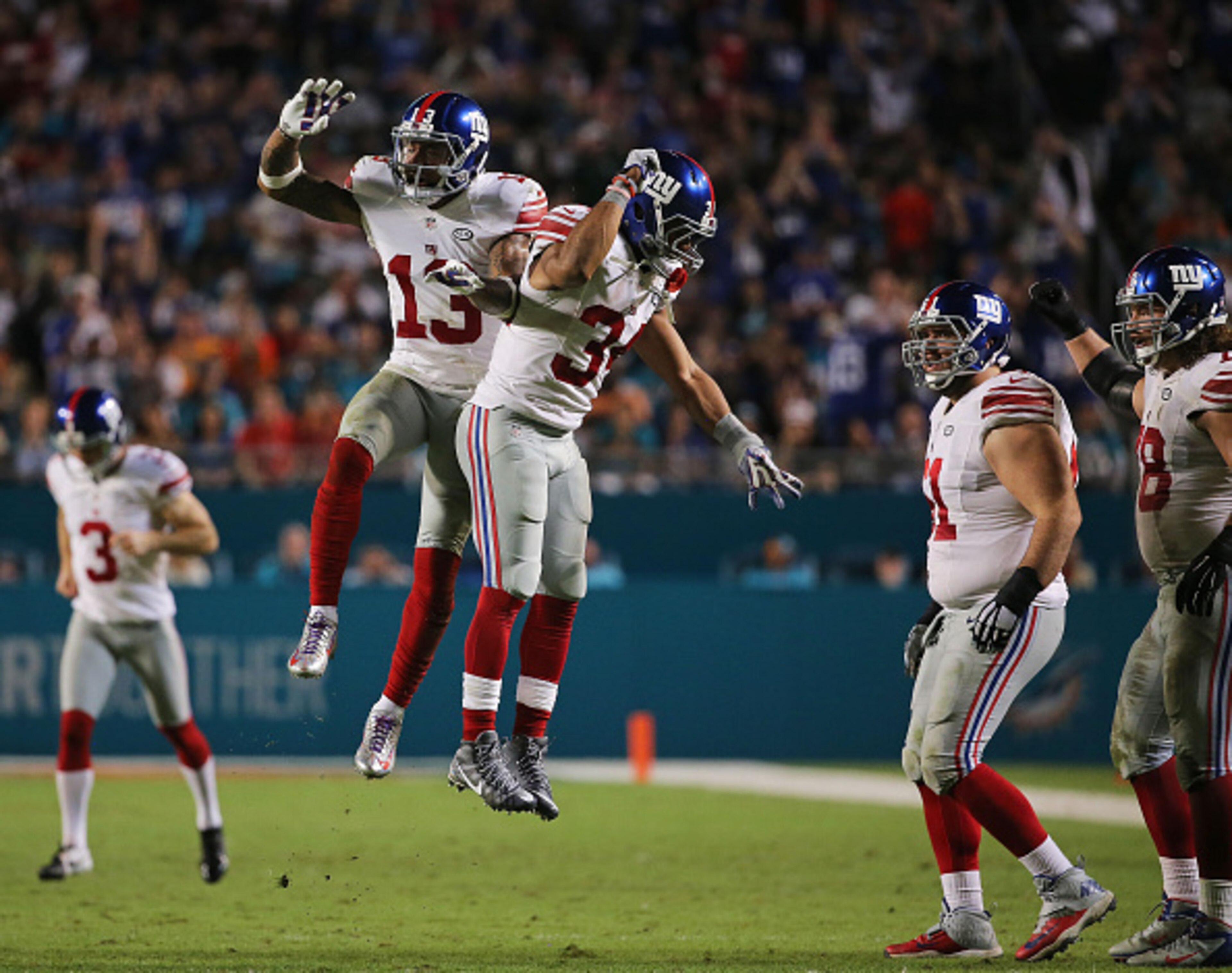 MIAMI GARDENS, FL - DECEMBER 14:  Odell Beckham #13 celebrates with Shane Vereen #34 of the New York Giants after scoring a touchdown during the third quarter of the game against the Miami Dolphins at Sun Life Stadium on December 14, 2015 in Miami Gardens