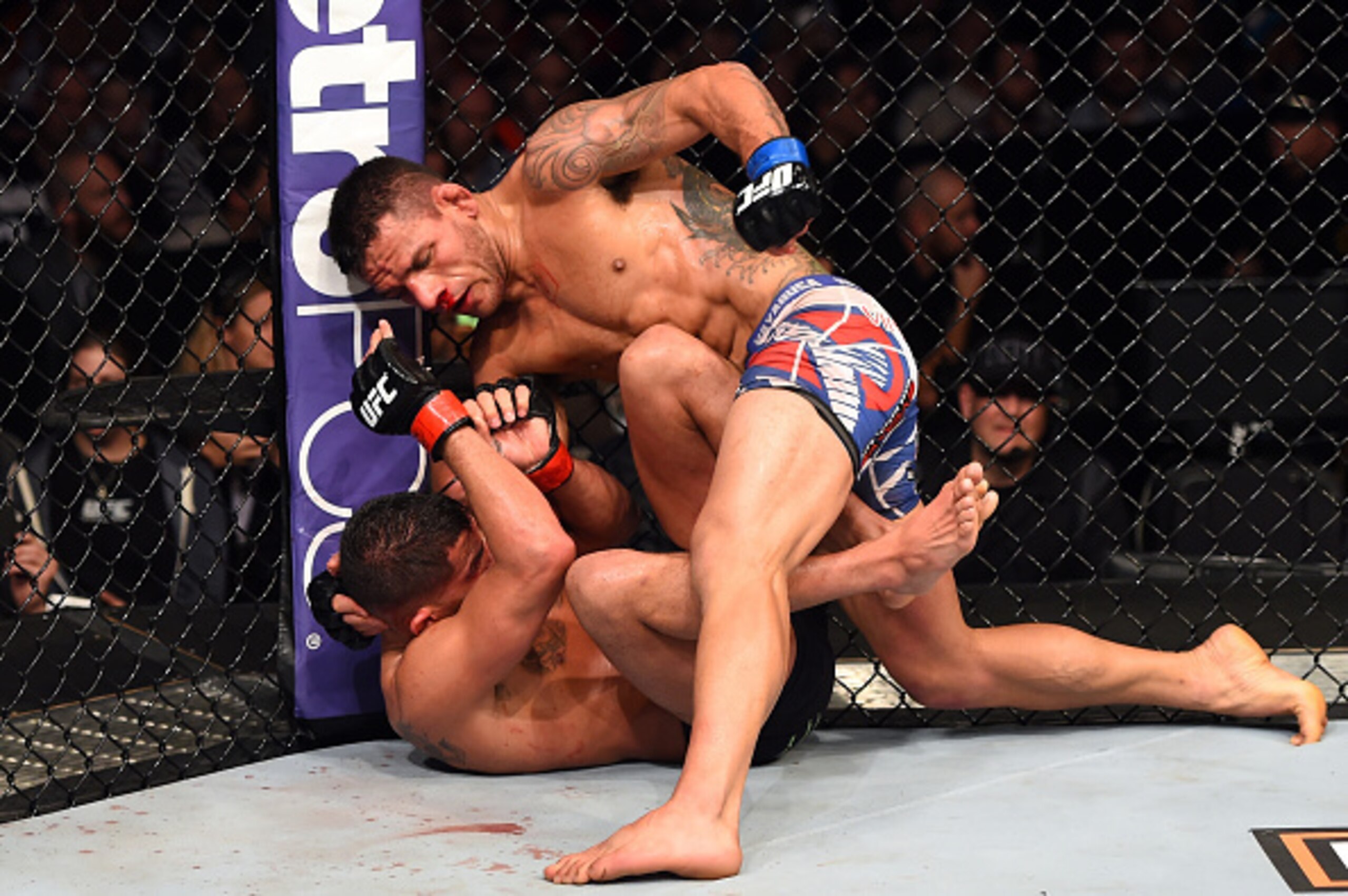 Dos Anjos batters Anthony Pettis at UFC 185.