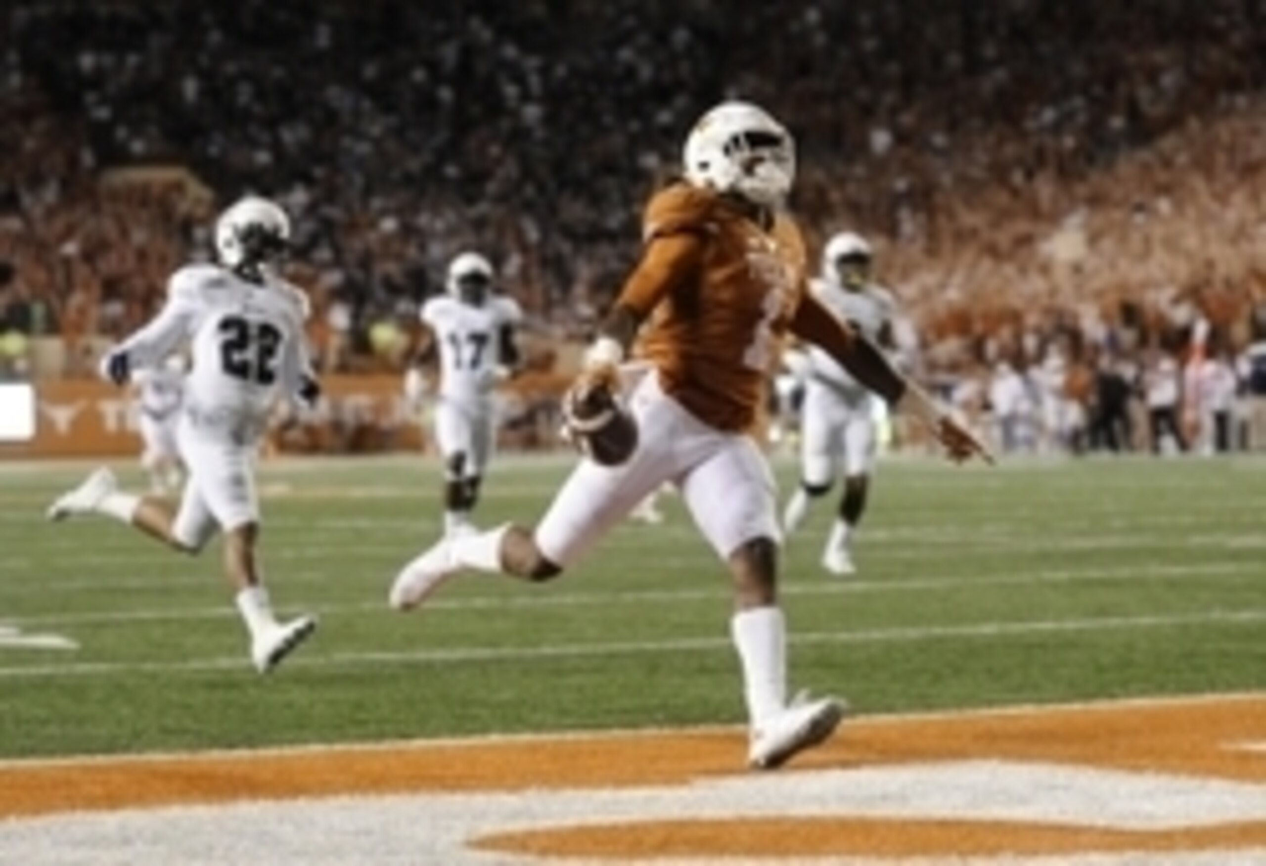 Sep 12, 2015; Austin, TX, USA; Texas Longhorns wide receiver John Burt (1) scores a touchdown against the Rice Owls during the third quarter at Darrell K Royal-Texas Memorial Stadium. Texas beat Rice 42-28. Mandatory Credit: Brendan Maloney-USA TODAY Spor