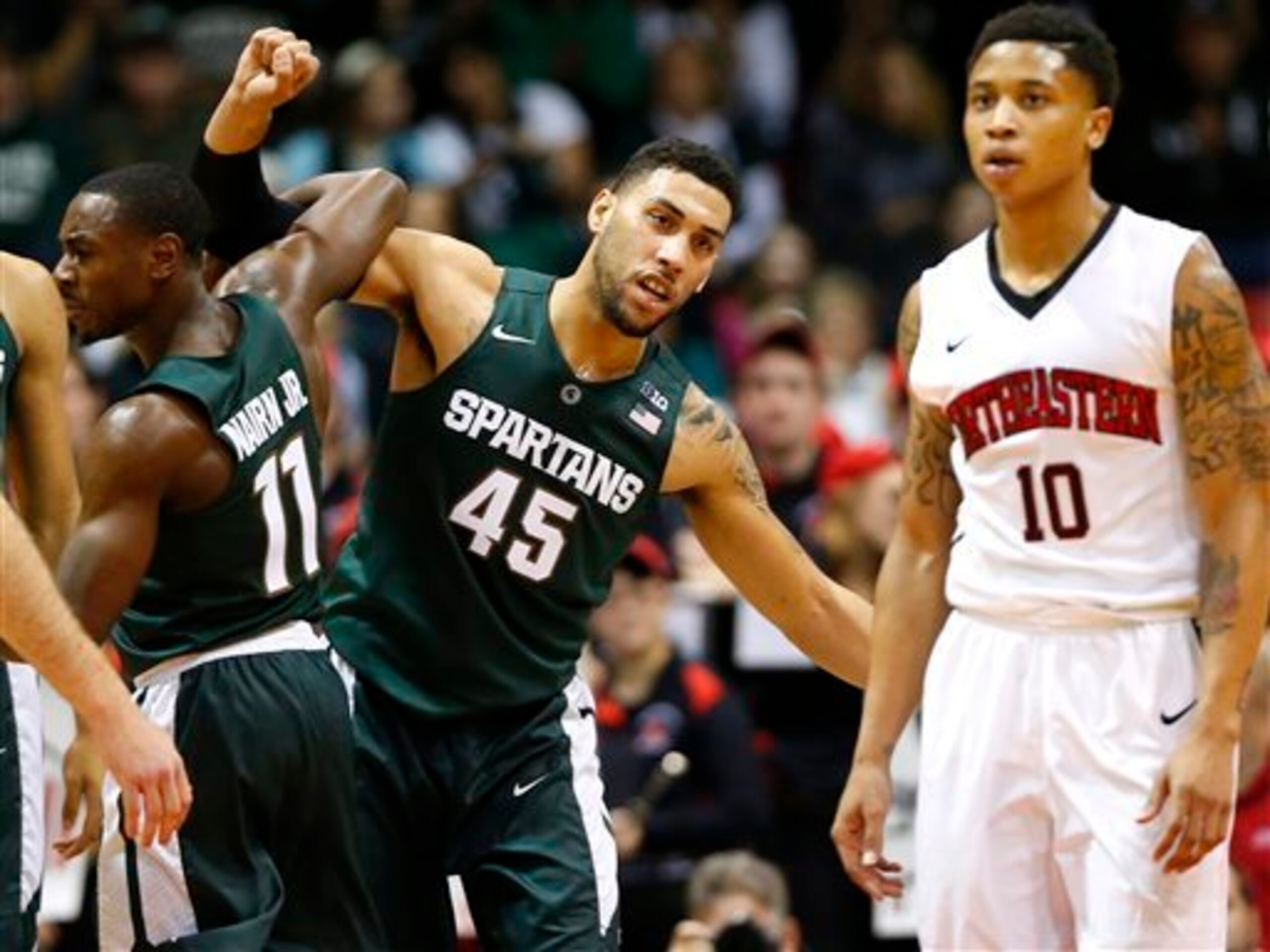 Denzel Valentine (center) celebrates another Michigan State win.