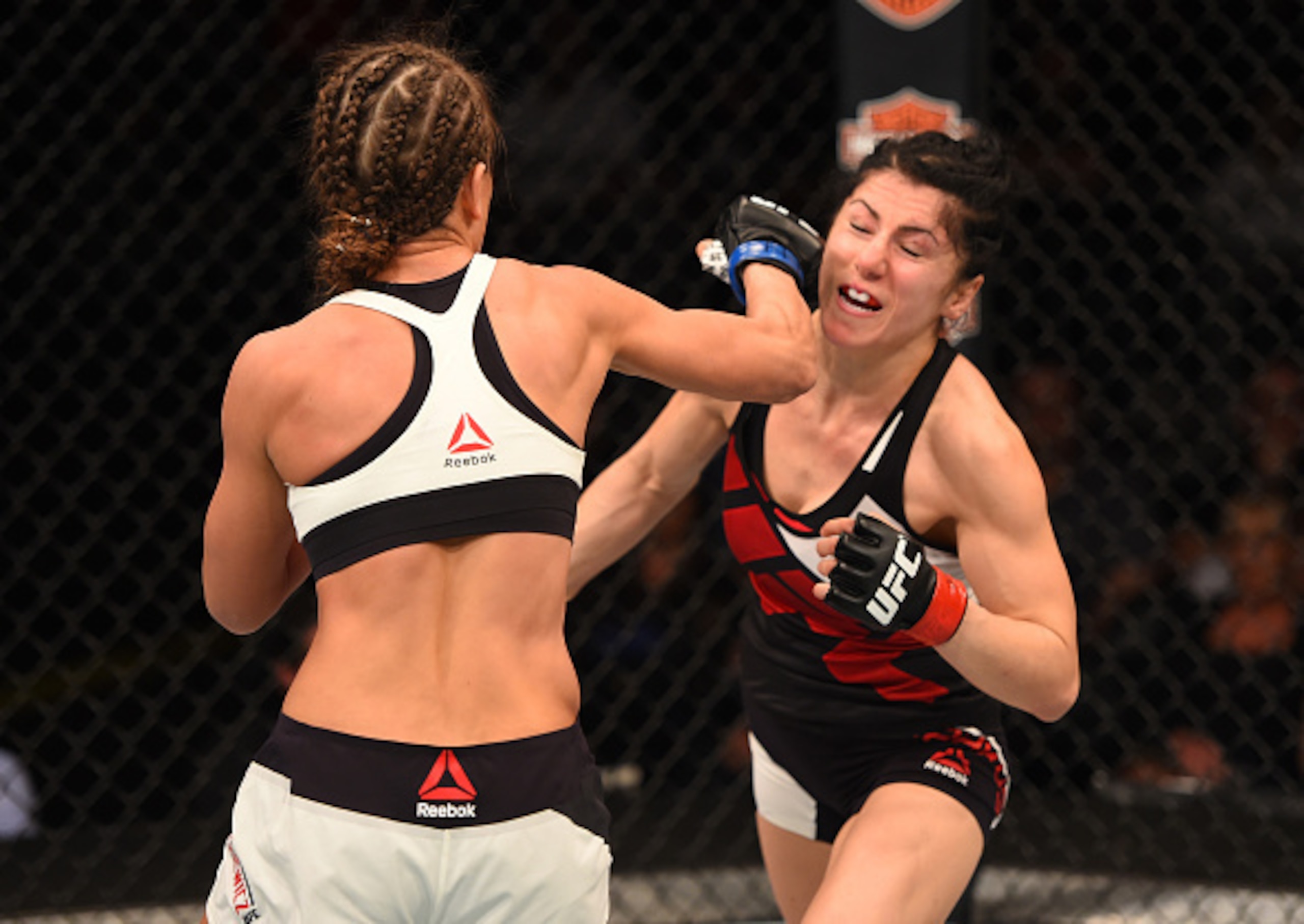 Karolina Kowalkiewicz delivers a right hand to Randa Markos in the opening main card contest.