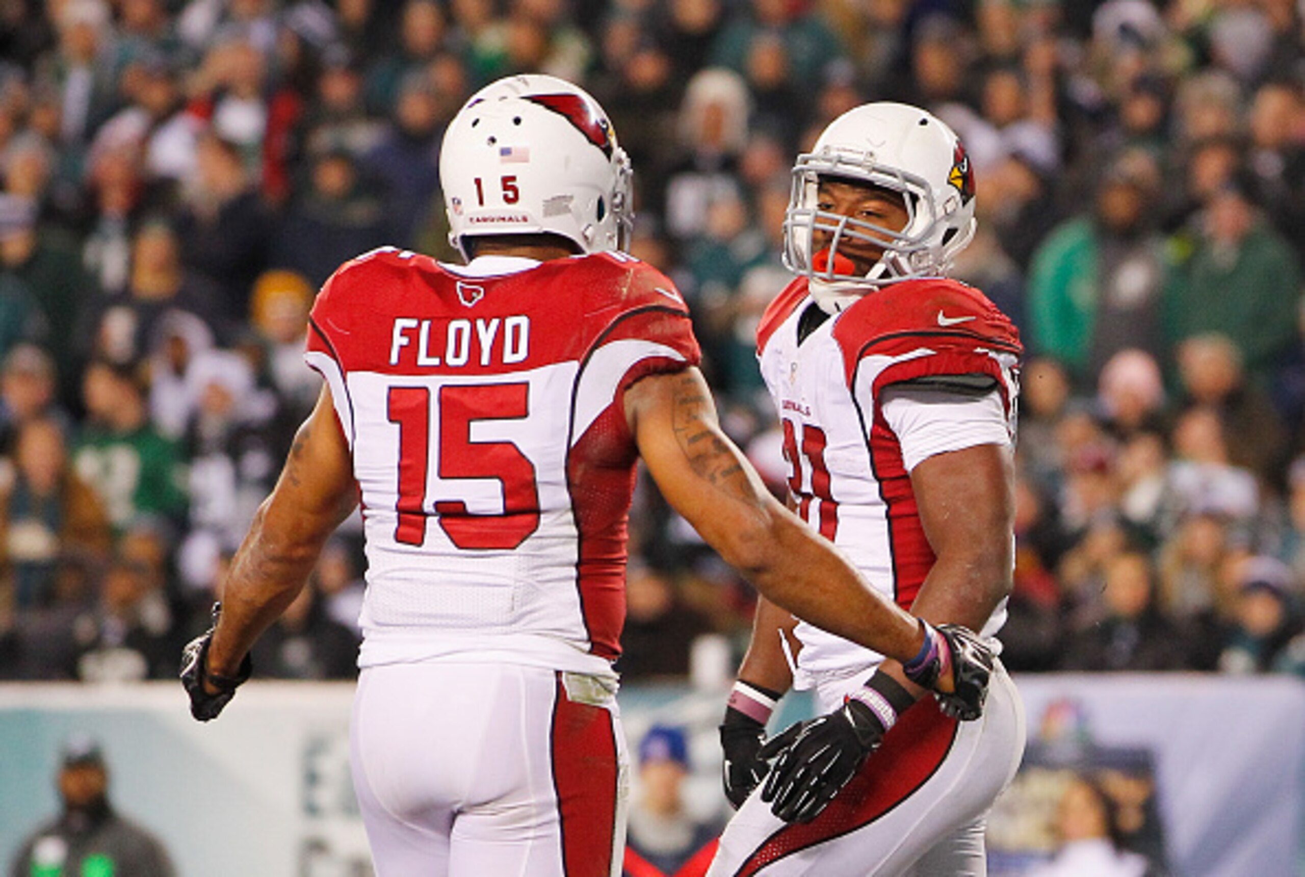 PHILADELPHIA, PA - DECEMBER 20:  David Johnson #31 of the Arizona Cardinals celebrates his rushing-touchdown in the third quarter with teammate Michael Floyd #15 against the Philadelphia Eagles at Lincoln Financial Field on December 20, 2015 in Philadelph