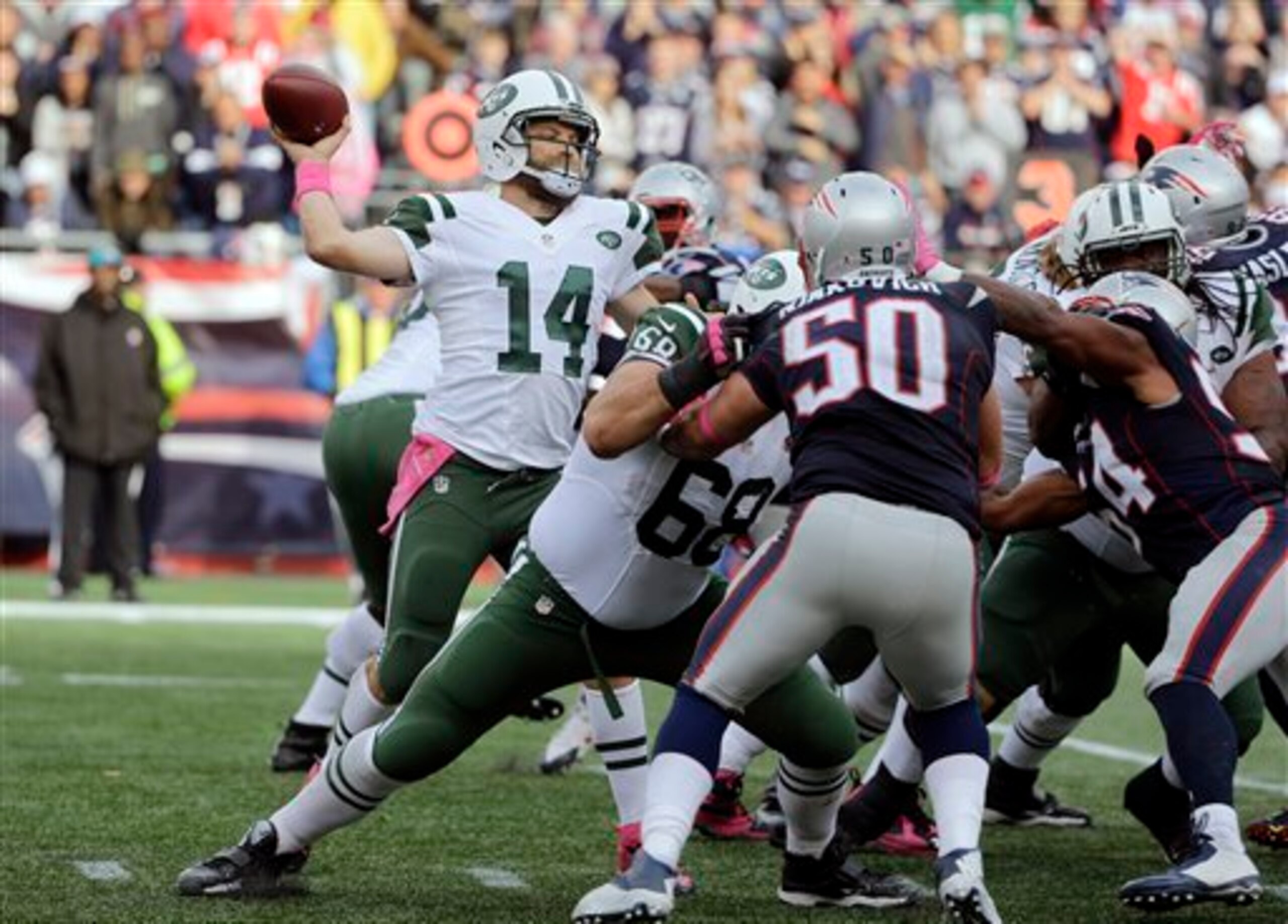 Ryan Fitzpatrick looks for an open receiver against the Patriots.