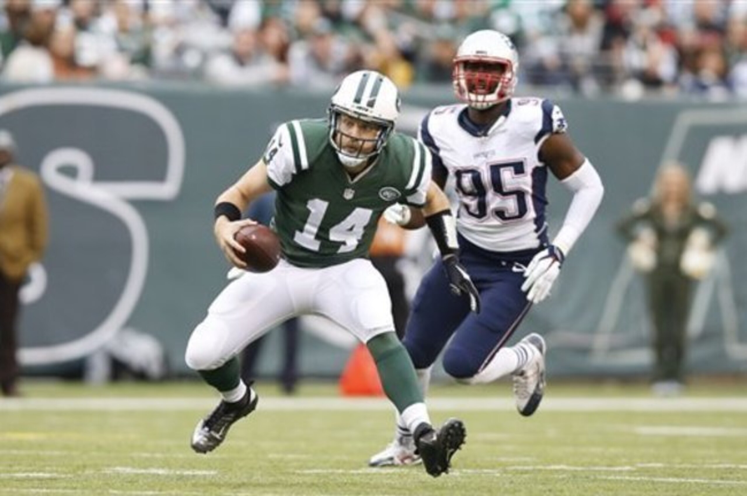 Ryan Fitzpatrick runs for extra yards against the Patriots.
