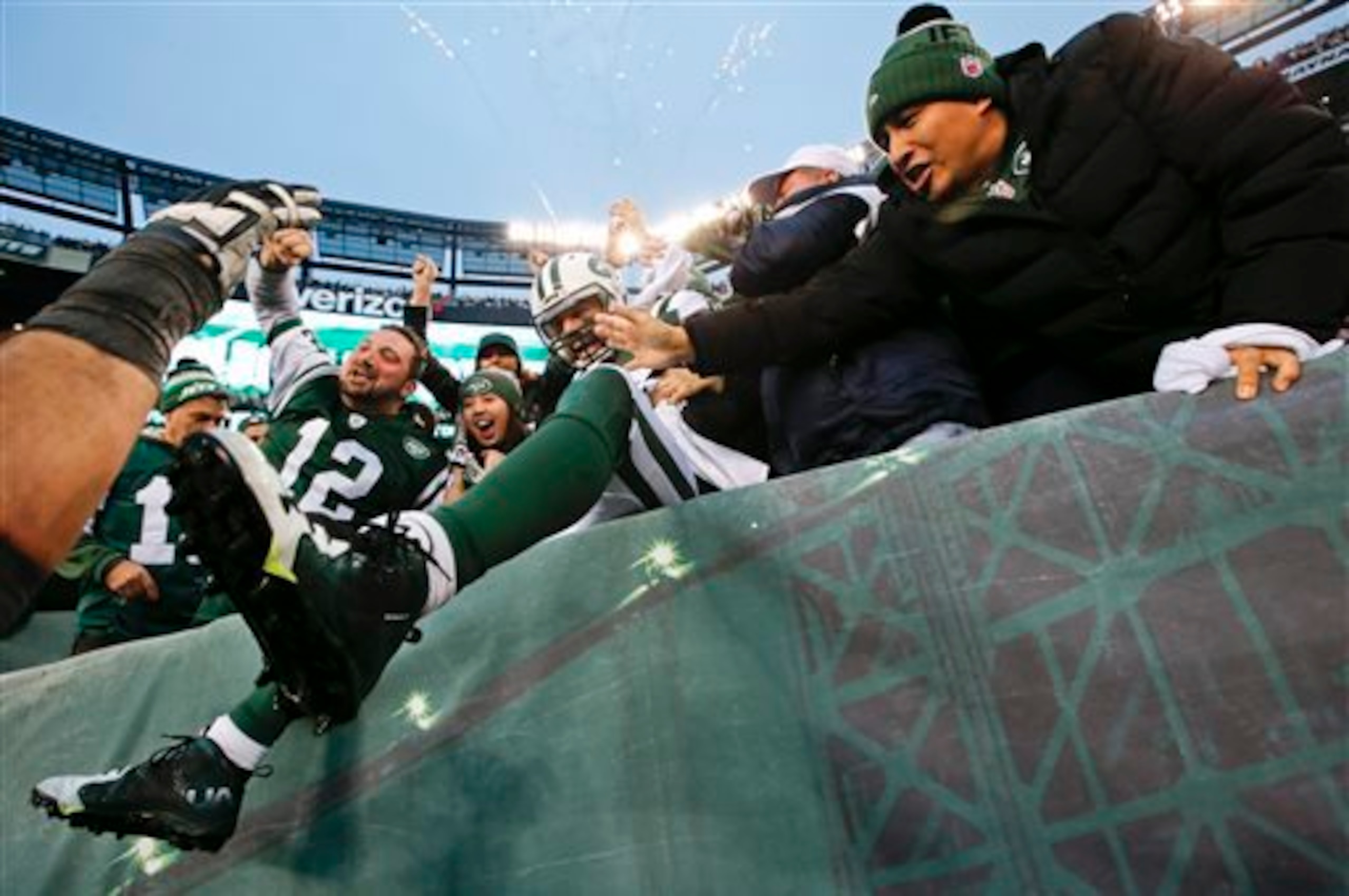 Eric Decker jumps in the stands to celebrate a touchdown.