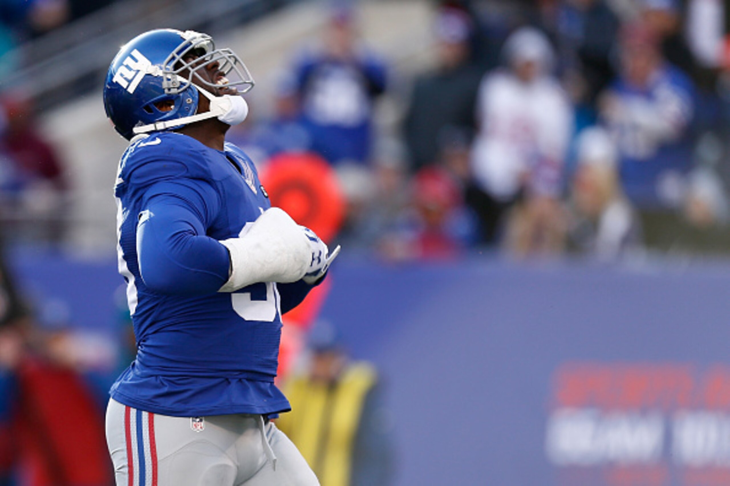 EAST RUTHERFORD, NJ - DECEMBER 20:  Jason Pierre-Paul #90 of the New York Giants reacts after sacking Cam Newton #1 of the Carolina Panthers in the second quarter during their game at MetLife Stadium on December 20, 2015 in East Rutherford, New Jersey.  (