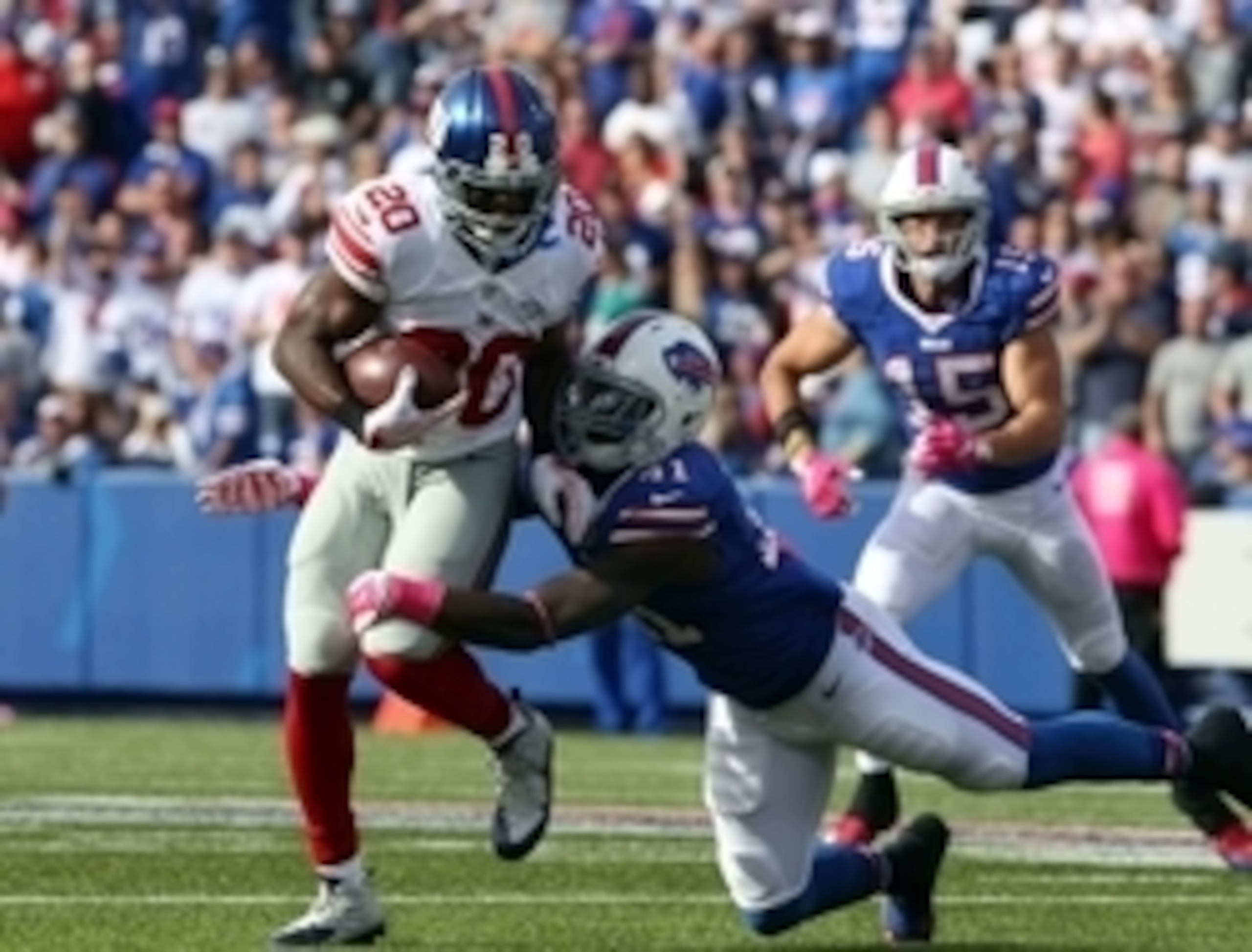 Oct 4, 2015; Orchard Park, NY, USA; New York Giants cornerback Prince Amukamara (20) recovers the ball and gets tackled by Buffalo Bills runningback Cierre Wood (41) during the second half at Ralph Wilson Stadium. Giants beat the Bills 24 to 10.  Mandator