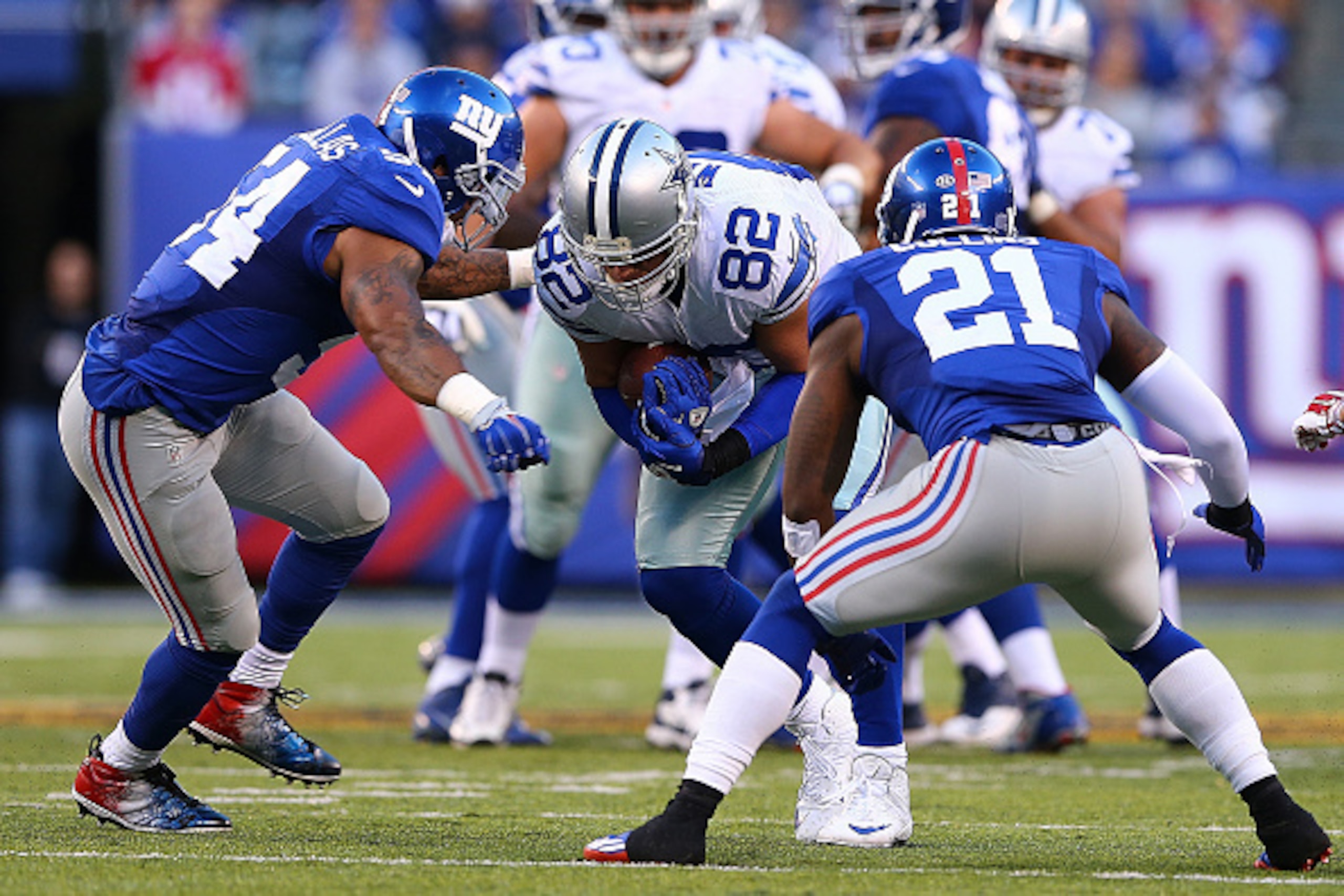 EAST RUTHERFORD, NJ - OCTOBER 25: Jason Witten #82 of the Dallas Cowboys is tackled by Jonathan Casillas #54 and Landon Collins #21 of the New York Giants during the second quarter at MetLife Stadium on October 25, 2015 in East Rutherford, New Jersey.  (P