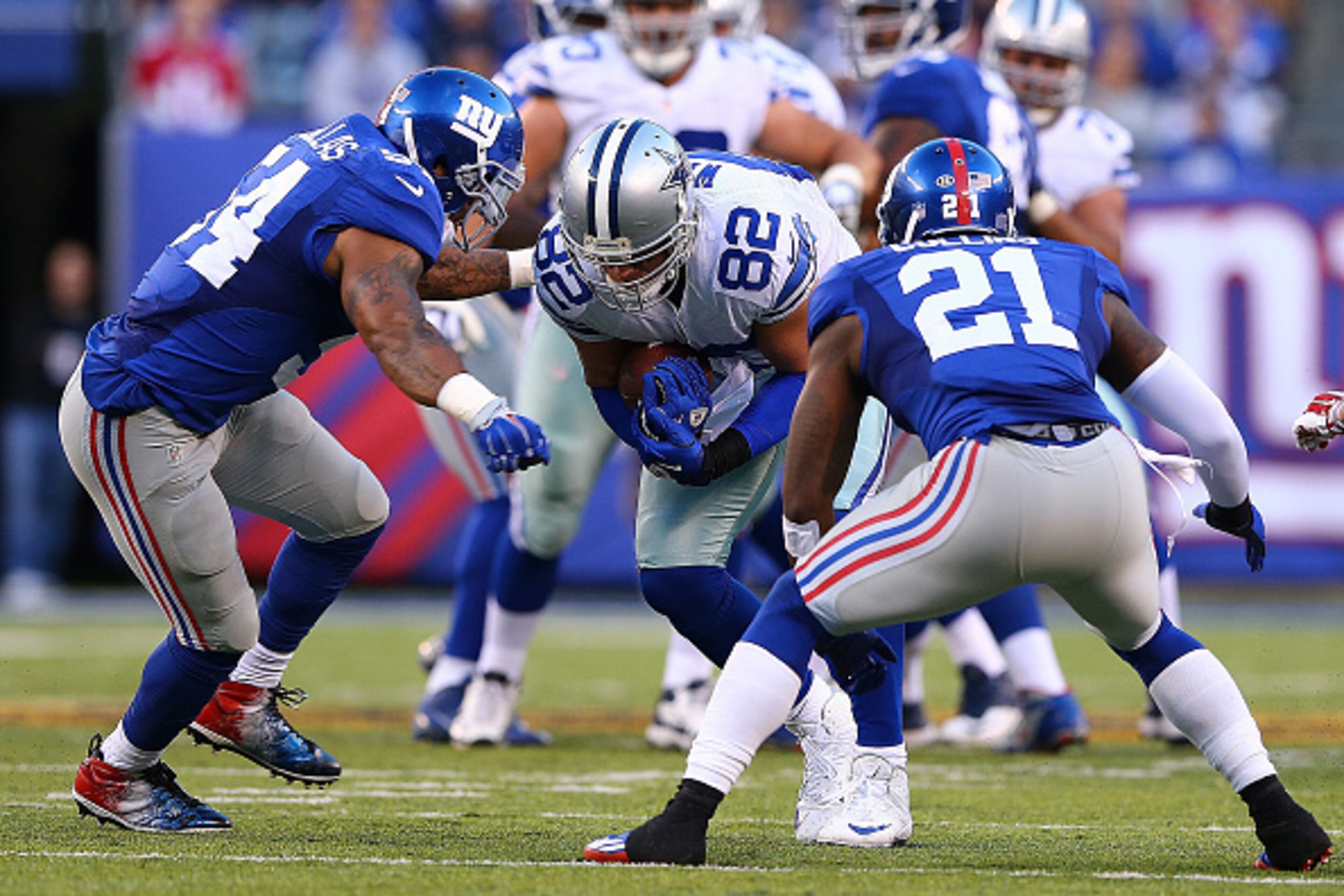 EAST RUTHERFORD, NJ - OCTOBER 25: Jason Witten #82 of the Dallas Cowboys is tackled by Jonathan Casillas #54 and Landon Collins #21 of the New York Giants during the second quarter at MetLife Stadium on October 25, 2015 in East Rutherford, New Jersey.  (P