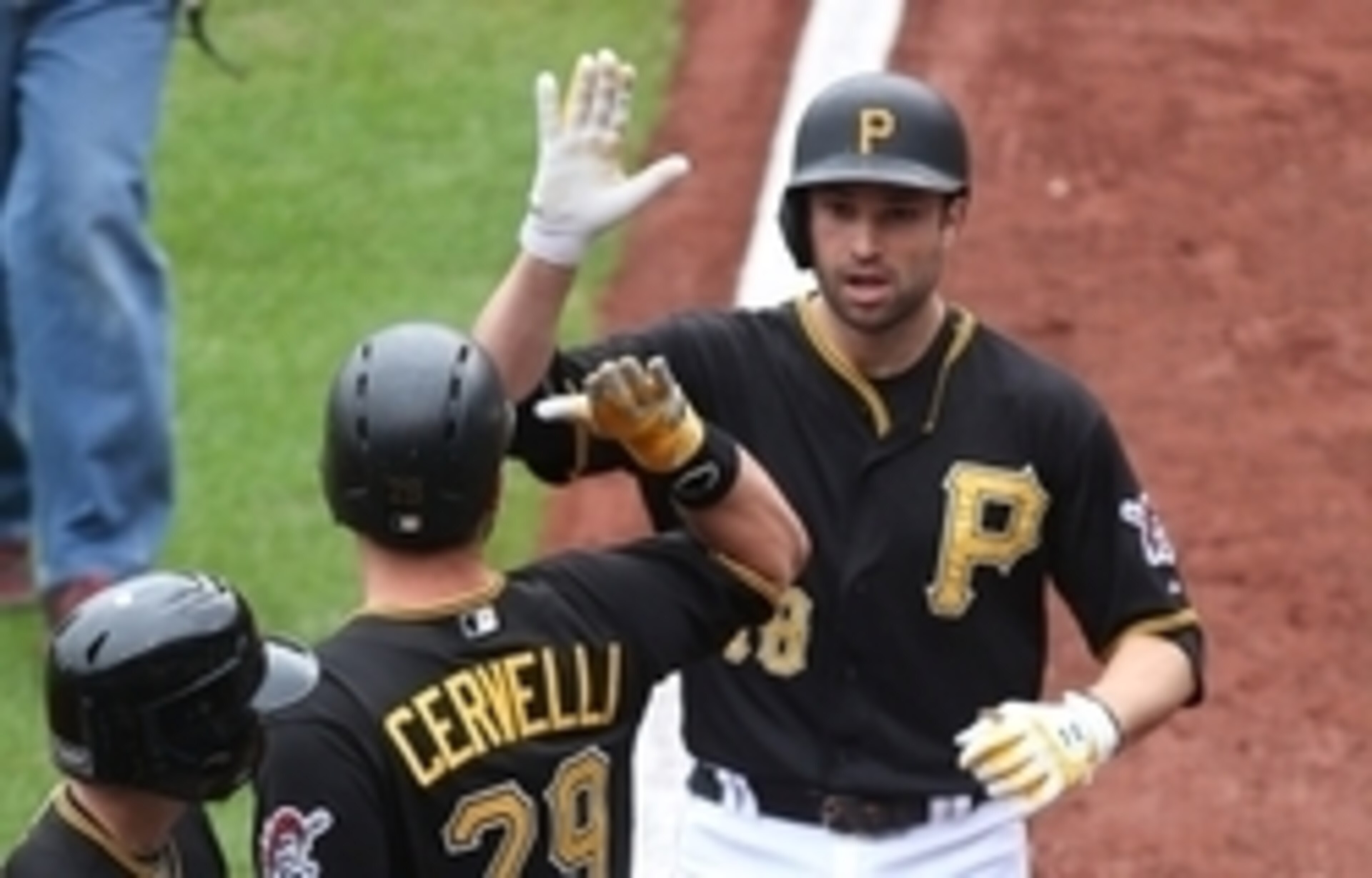 Sep 30, 2015; Pittsburgh, PA, USA; Pittsburgh Pirates catcher Francisco Cervelli (29) congratulates second baseman Neil Walker (18) after Walker hit a solo home run against the St. Louis Cardinals during the second inning at PNC Park. Mandatory Credit: Ch
