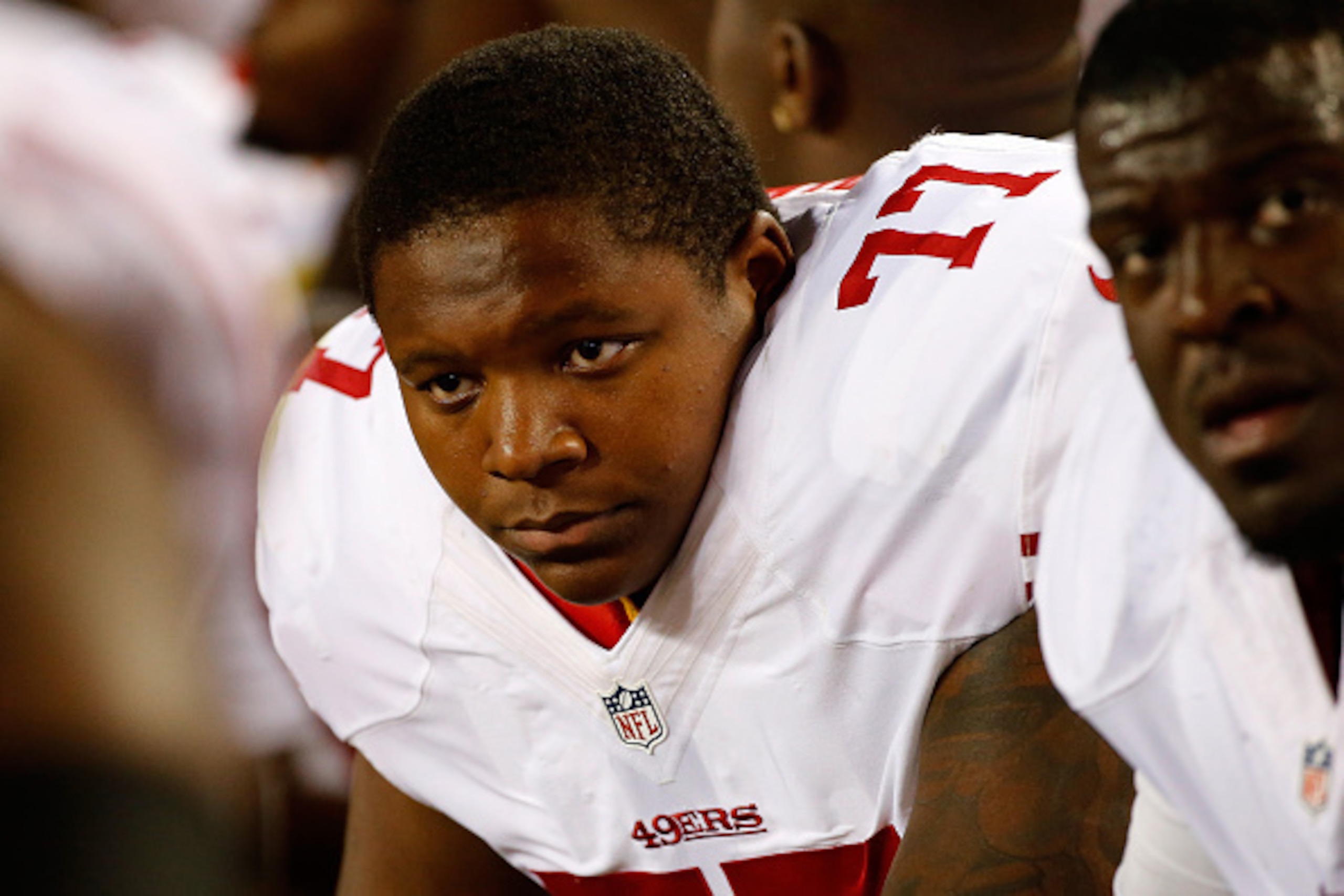 DENVER, CO - AUGUST 29:  Offensive tackle Trenton Brown #77 of the San Francisco 49ers looks on from the bench against the Denver Broncos during preseason action at Sports Authority Field at Mile High on August 29, 2015 in Denver, Colorado. The Broncos de