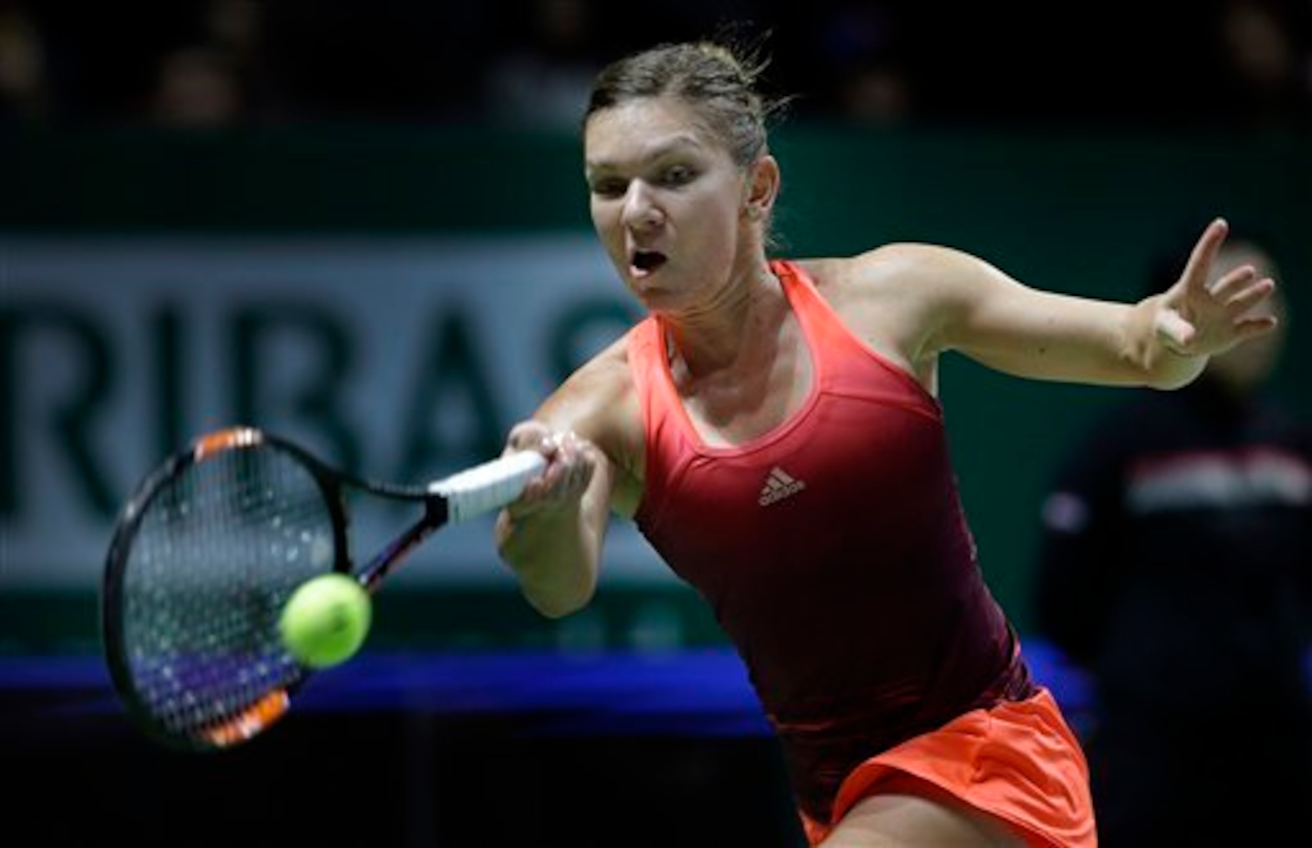 Simona Halep hits a forehand during a match at the 2015 WTA Tour Championships.