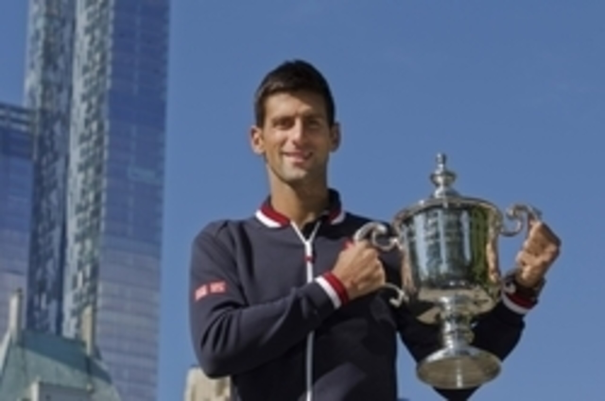 Novak Djokovic poses with the trophy after winning the 2015 U.S. Open.