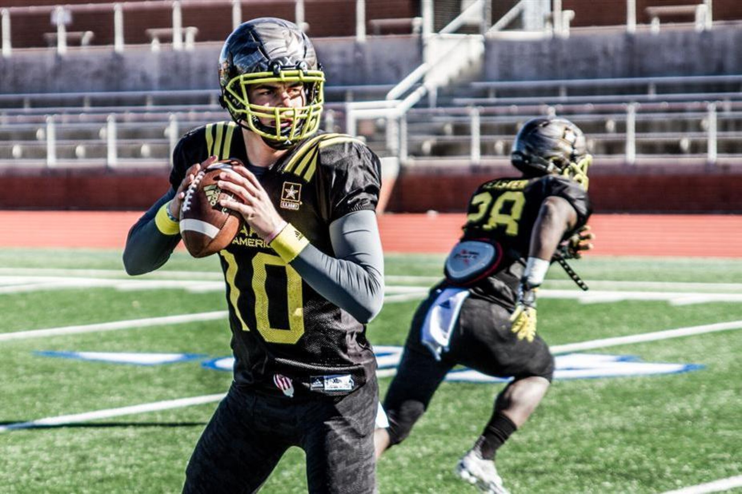 As Georgia quarterback commit Jacob Eason (10) looks for a target, Clemson running back commit Tavian Feaster runs a route out of the backfield. These are two athletes who could see great success in college that could parlay into an opportunity to play professionally.