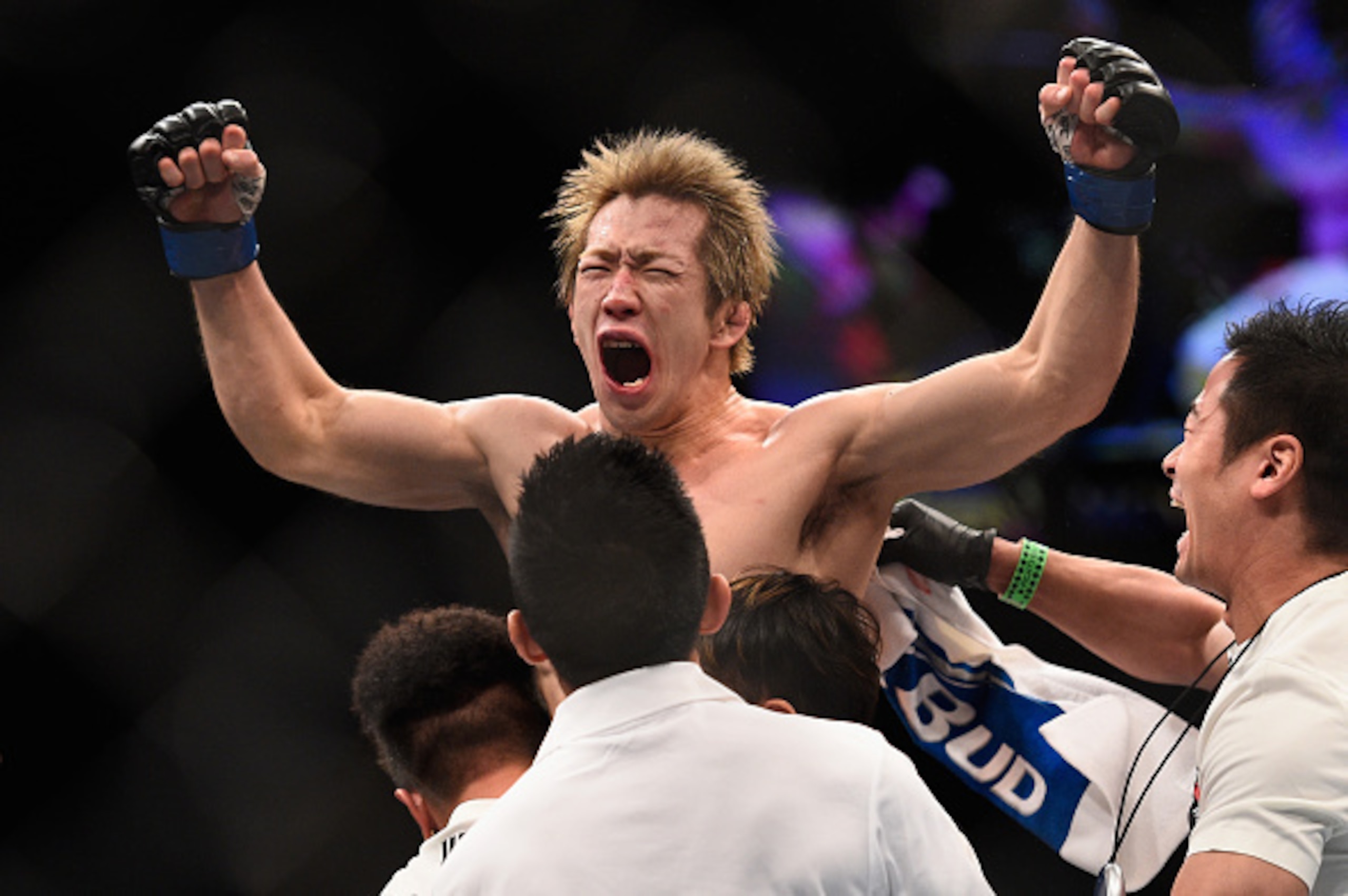 Michinori Tanaka celebrates after defeating Joe Soto. Michinori Tanaka celebrates after defeating Joe Soto.