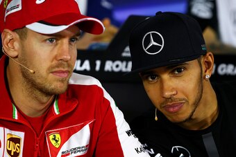 Sebastian Vettel (left) in his element with Lewis Hamilton at an Australian Grand Prix press conference.