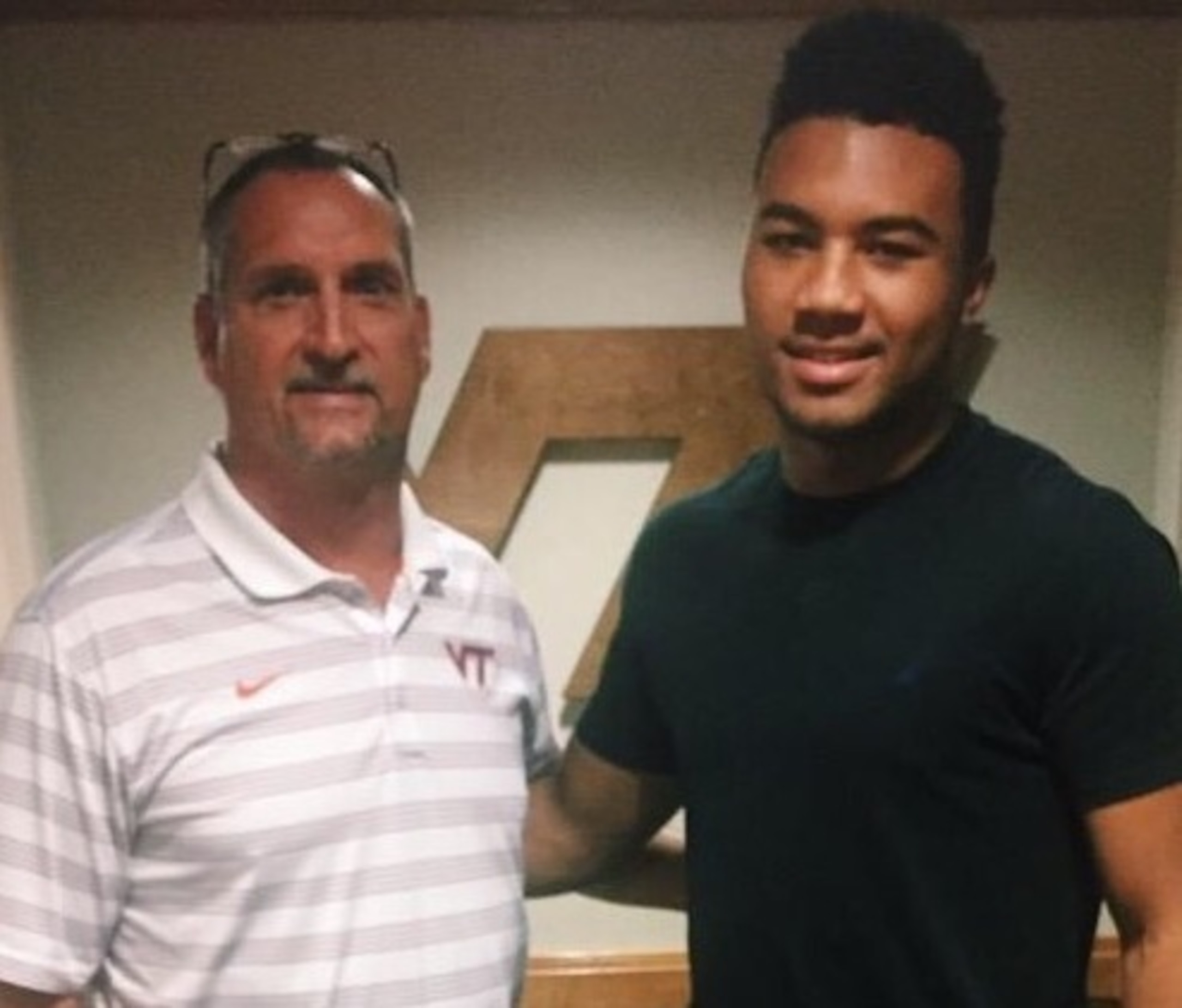 Virginia Tech defensive coordinator Bud Foster and linebacker Keith Simms