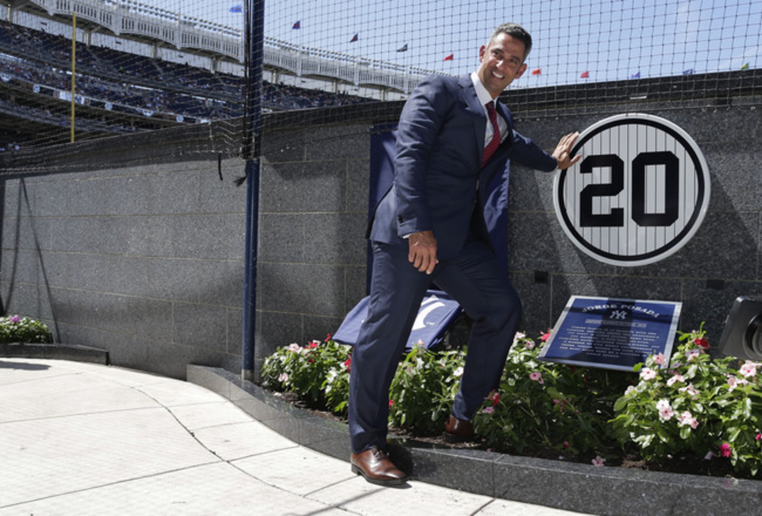 Jorge Posada in front of his plaque in Monument Park after his number was retired at the beginning of 2015.