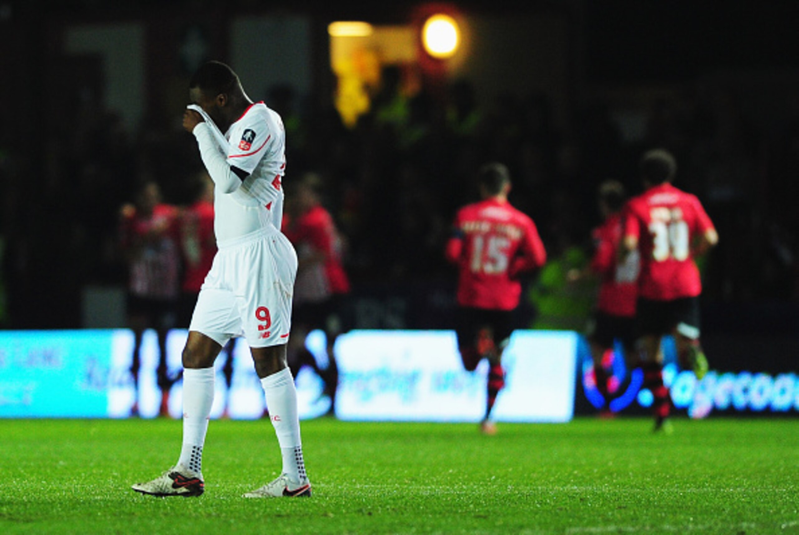 EXETER, ENGLAND - JANUARY 08:  Christian Benteke of Liverpool (9) reacts as Tom Nichols of Exeter City scores the opening goal during the Emirates FA Cup third round match between Exeter City and Liverpool at St James Park on January 8, 2016 in Exeter, En