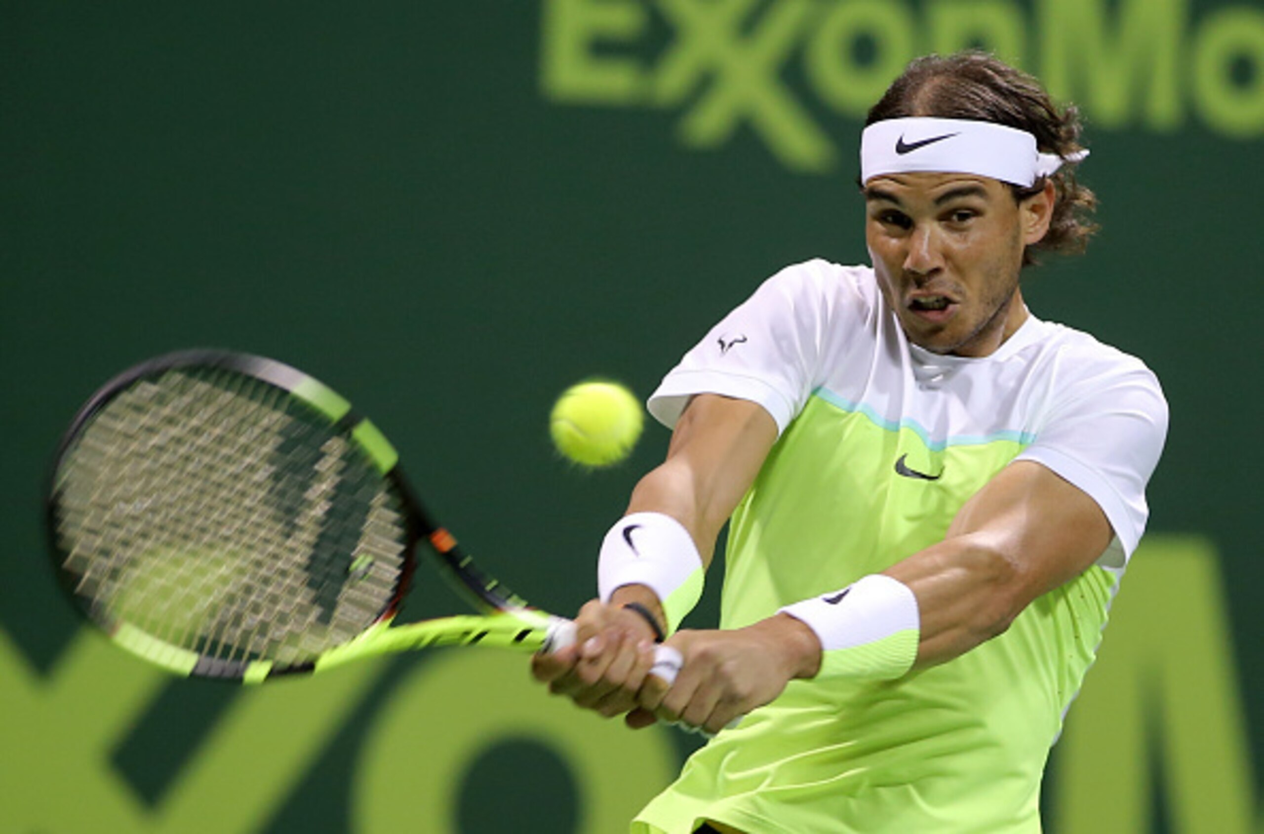 Rafael Nadal hits a backhand during the finals in Doha.