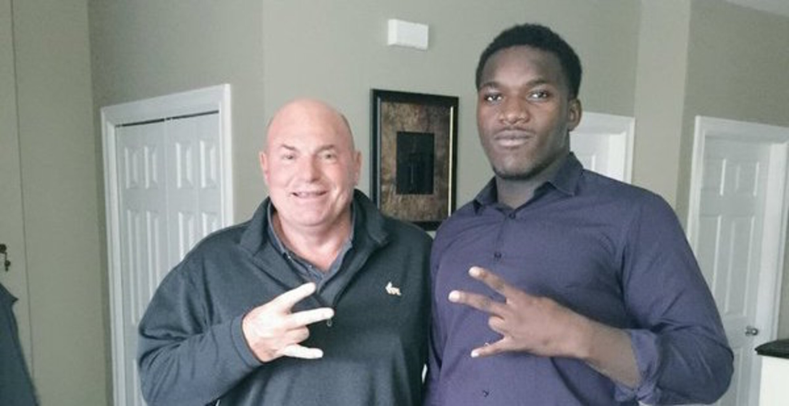 Jonathan Kongbo (right) with Tennessee defensive line coach Steve Stripling.