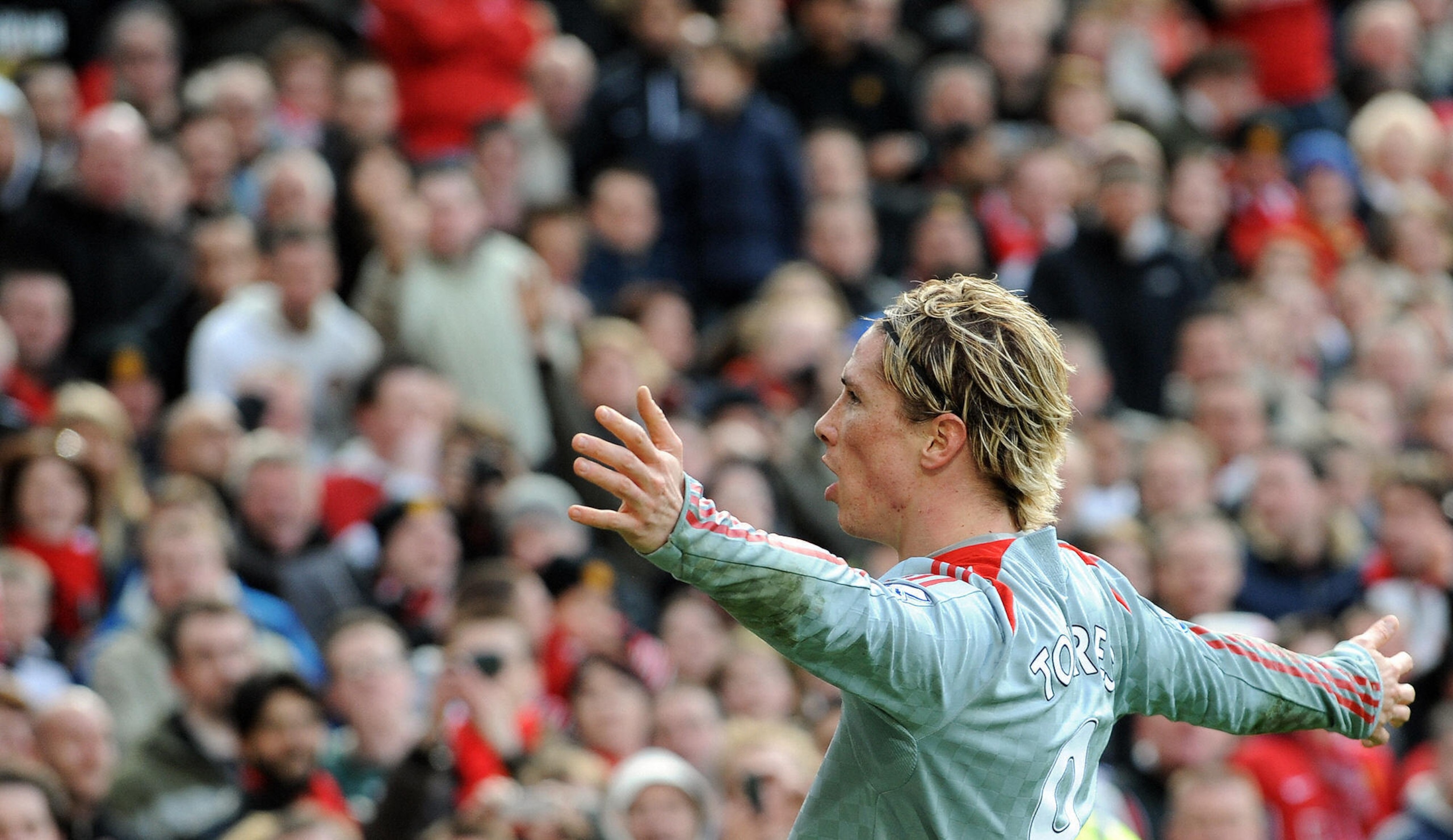 Fernando Torres celebrates an Old Trafford goal. Fernando Torres celebrates an Old Trafford goal.