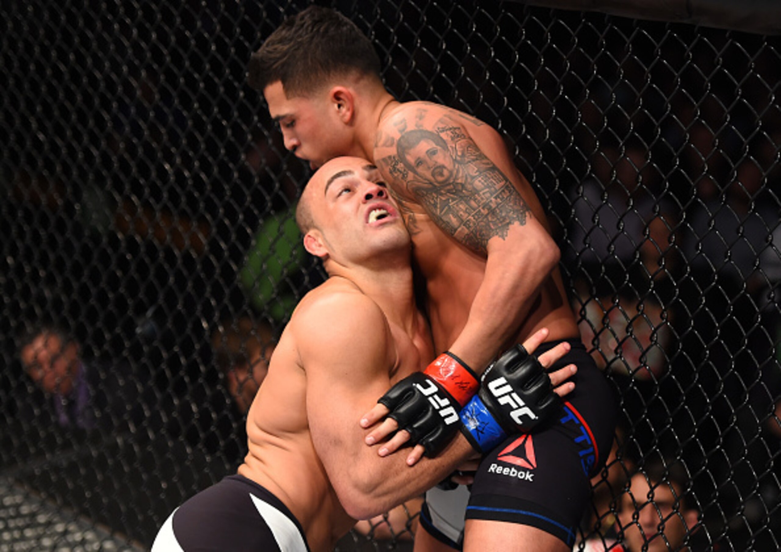 Eddie Alvarez presses Anthony Pettis against the fence en route to a split-decision win.