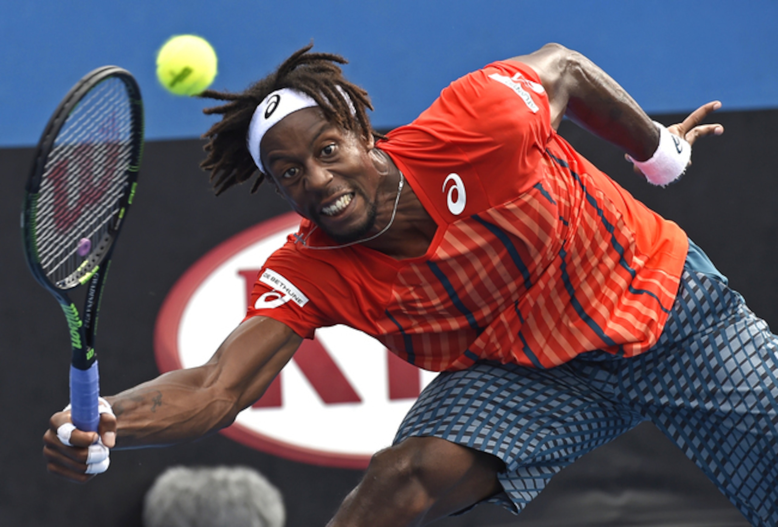 Gael Monfils reaches to make a play during his first-round match at the Australian Open.