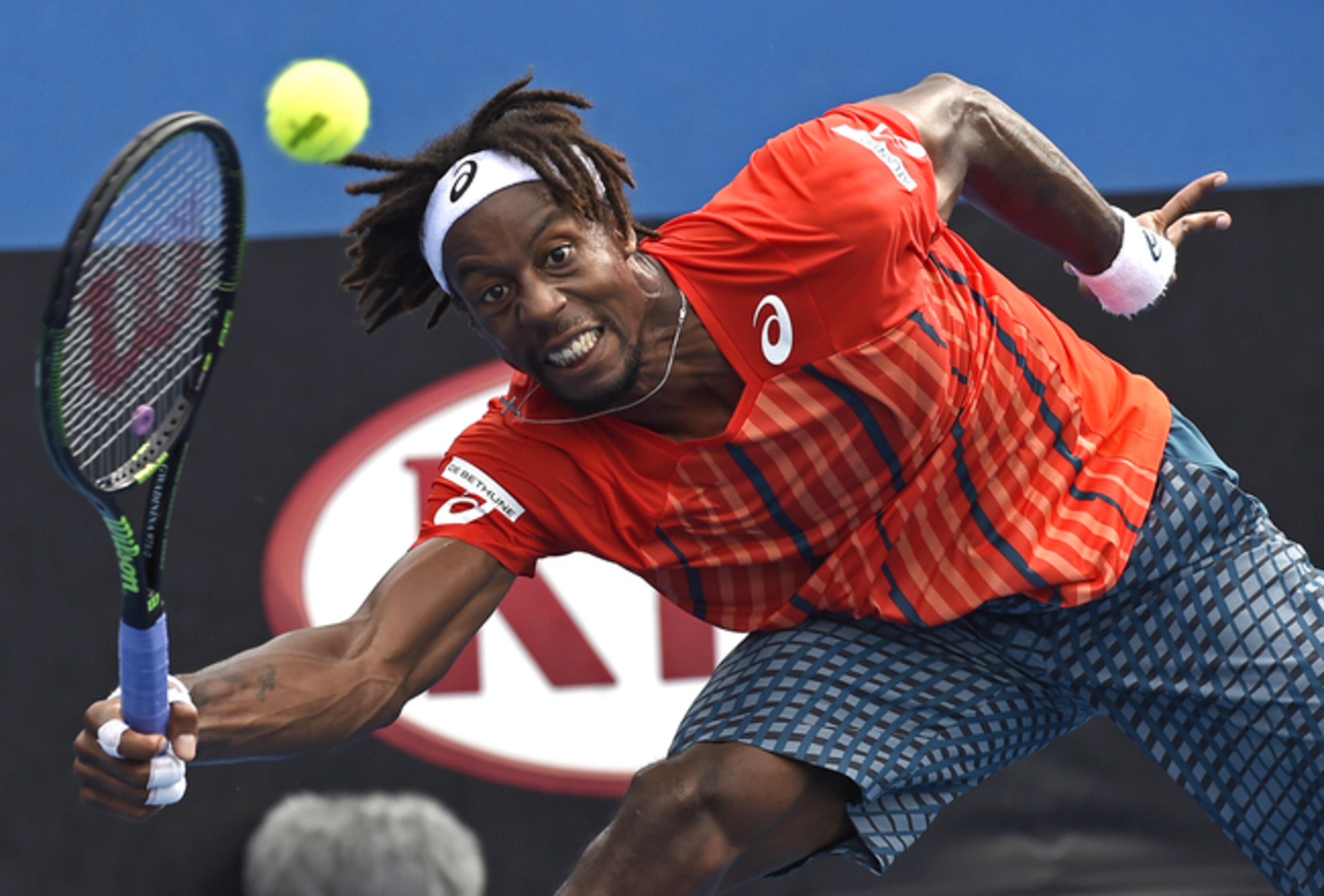 Gael Monfils reaches to make a play during his first-round match at the Australian Open.