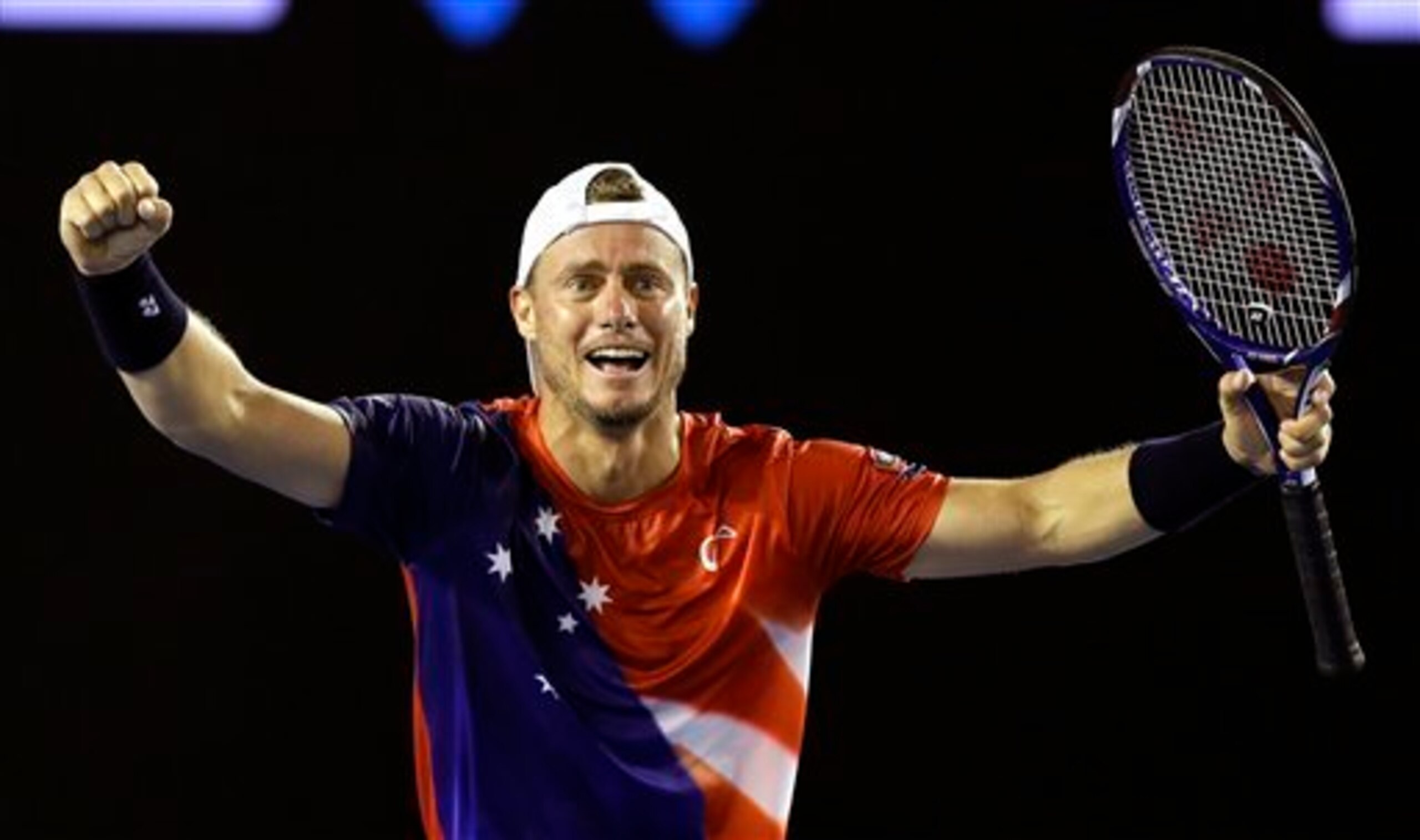 Lleyton Hewitt wears the Aussie Flag in his final appearance at the Australian Open.