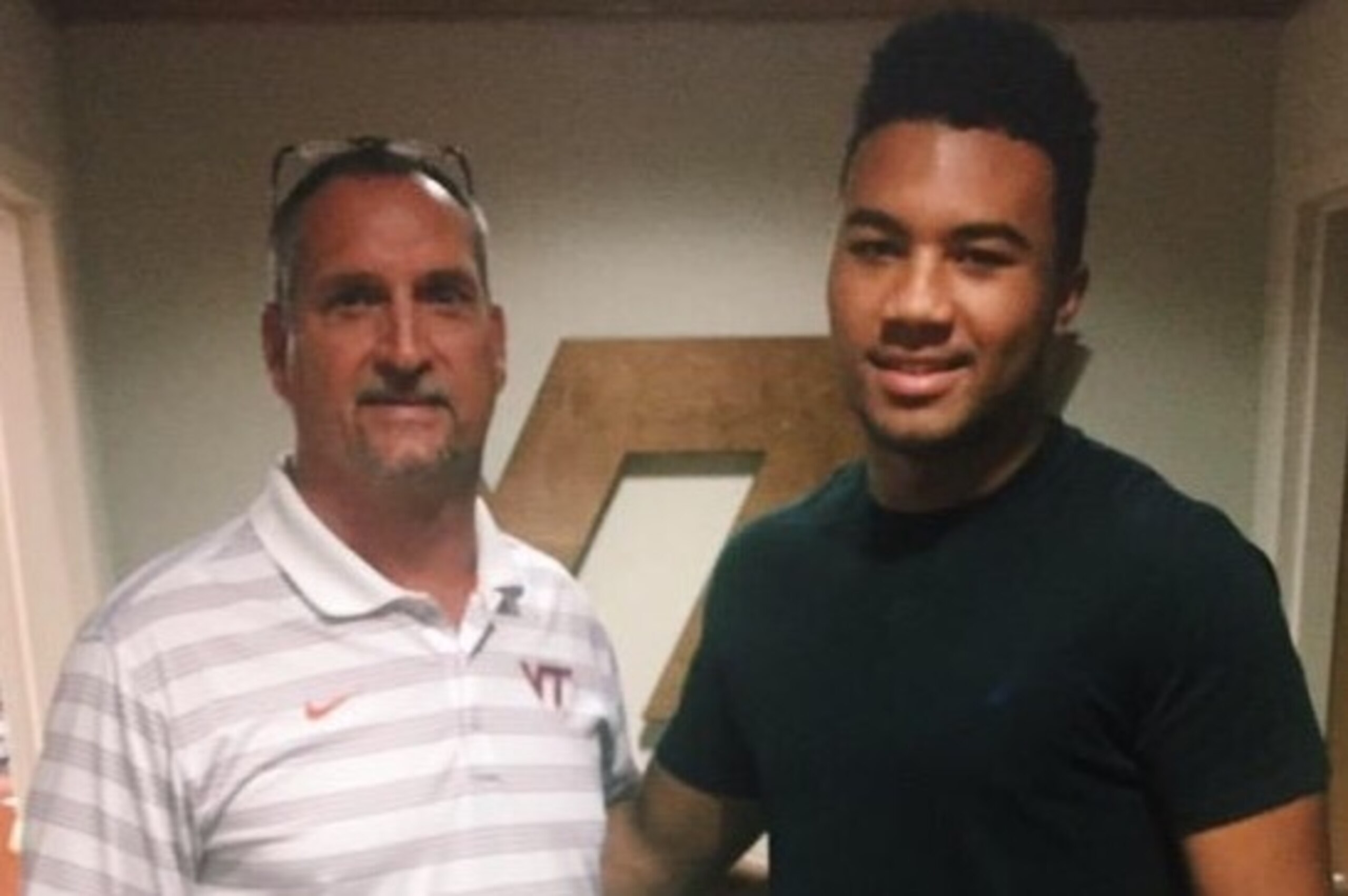 Virginia Tech defensive coordinator Bud Foster and linebacker recruit Keith Simms