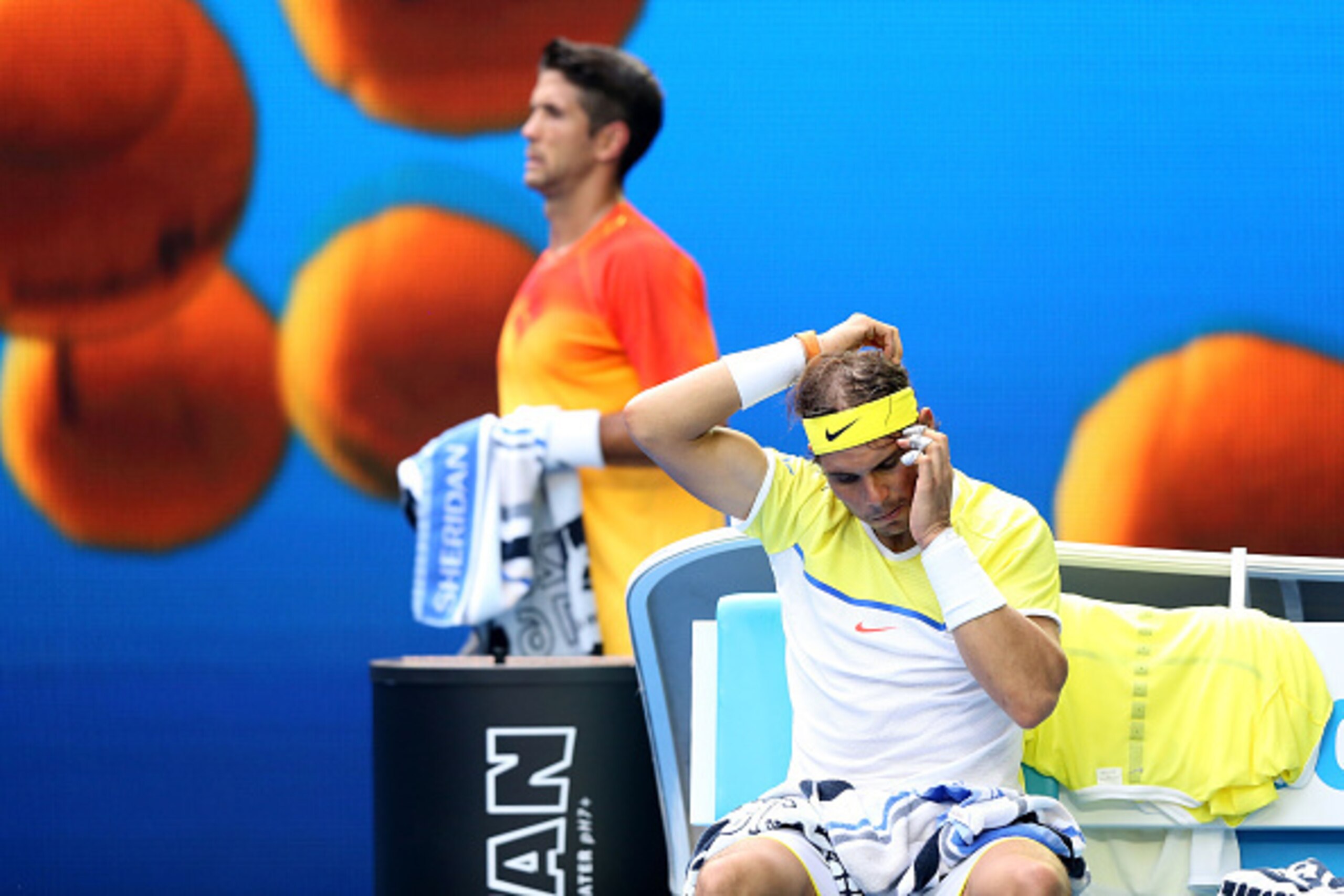 Fernando Verdasco walks behind Rafael Nadal during their first-round match at the 2016 Australian Open.