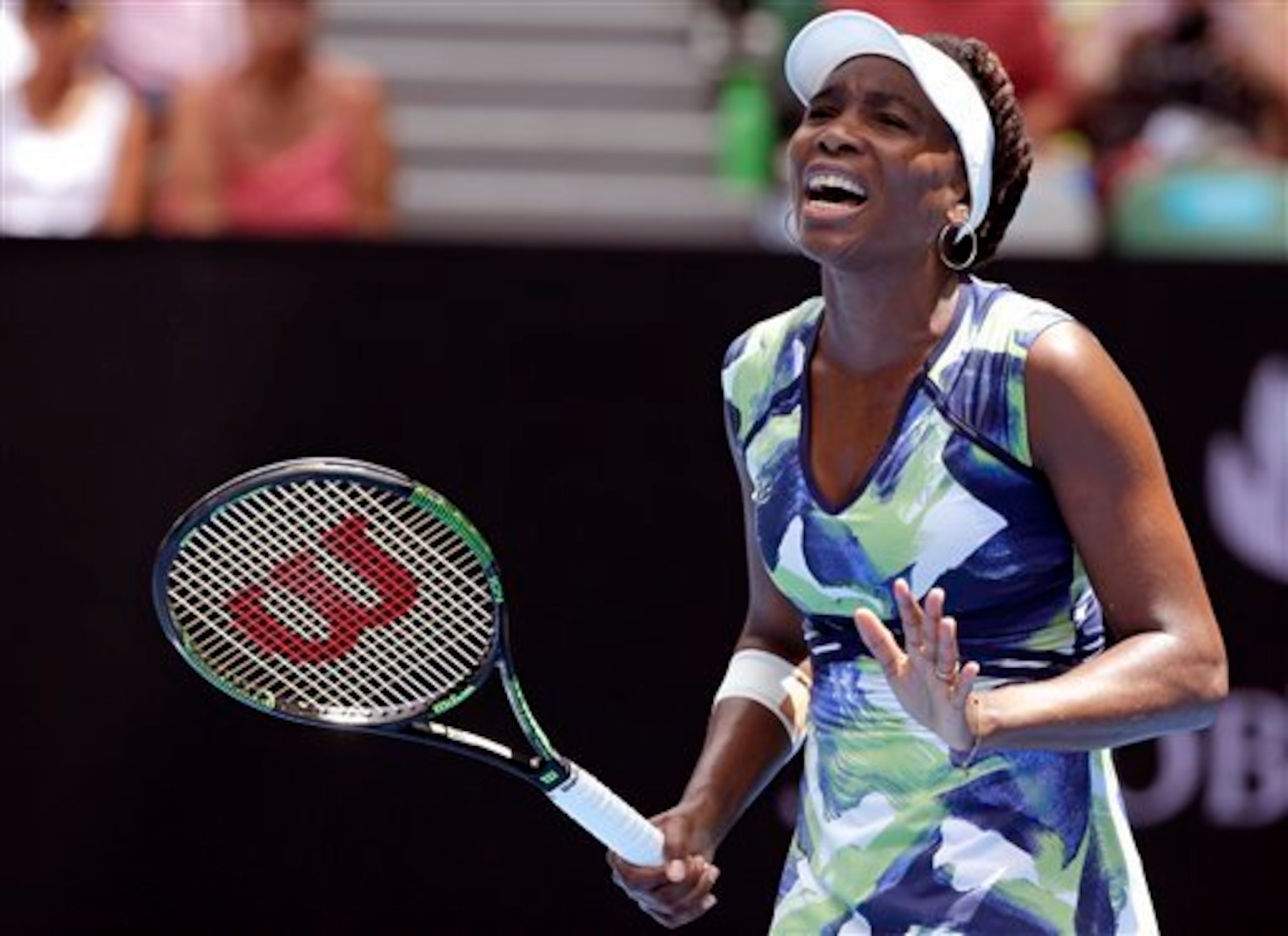 Venus Williams struggles during a first-round loss at the 2016 Australian Open.