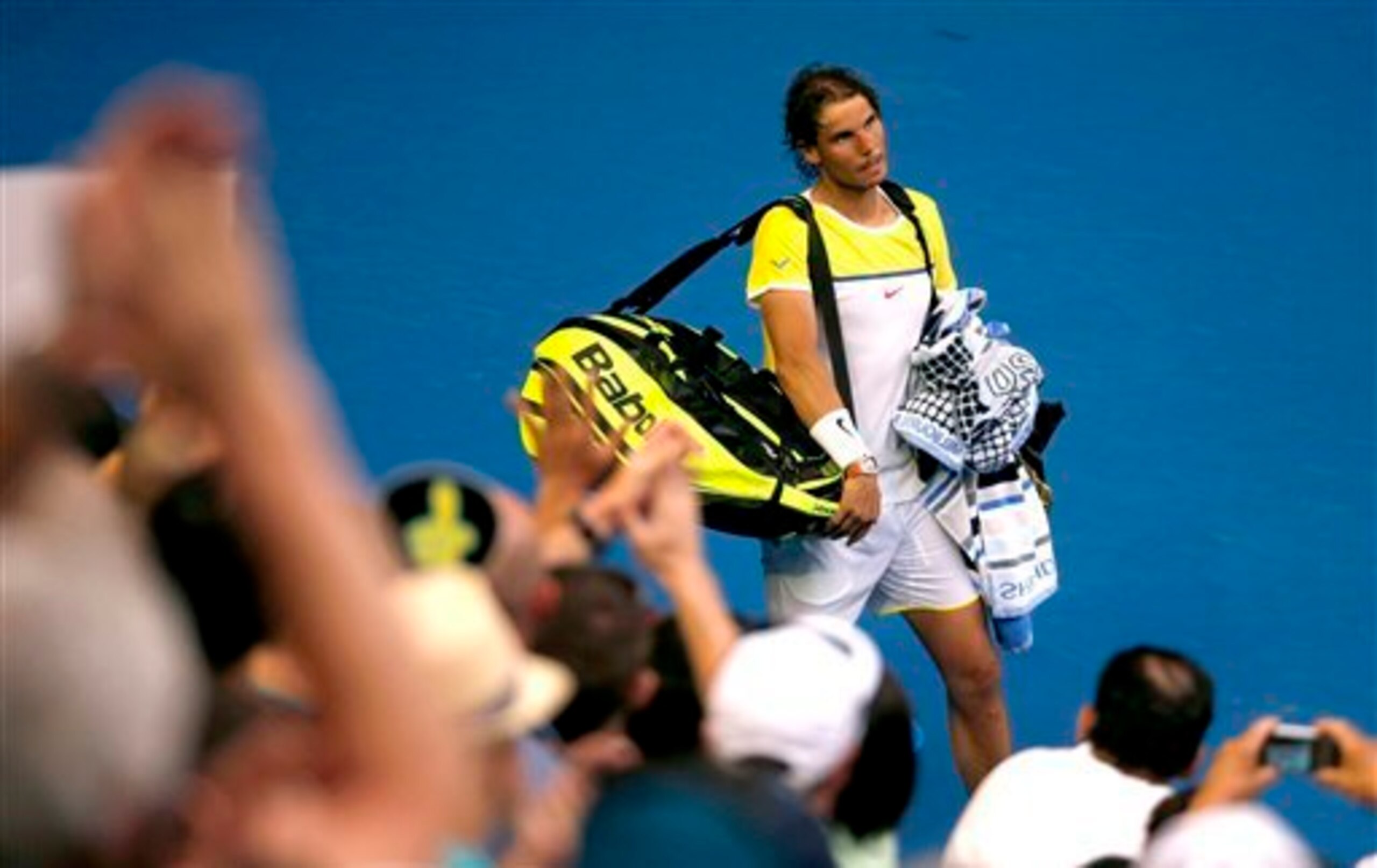 Rafael Nadal leaves the court after losing his first-round match at the Australian Open.