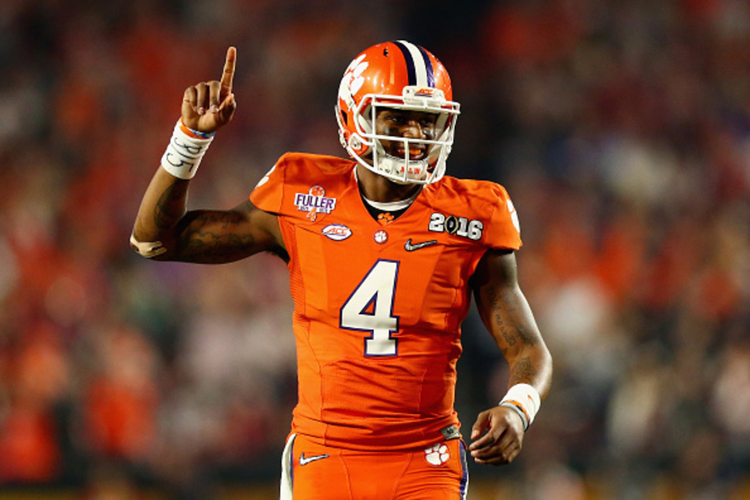 GLENDALE, AZ - JANUARY 11:  Deshaun Watson #4 of the Clemson Tigers celebrates after throwing an 11 yard touchdown pass to Hunter Renfrow #13 in the first quarter against the Alabama Crimson Tide during the 2016 College Football Playoff National Champions
