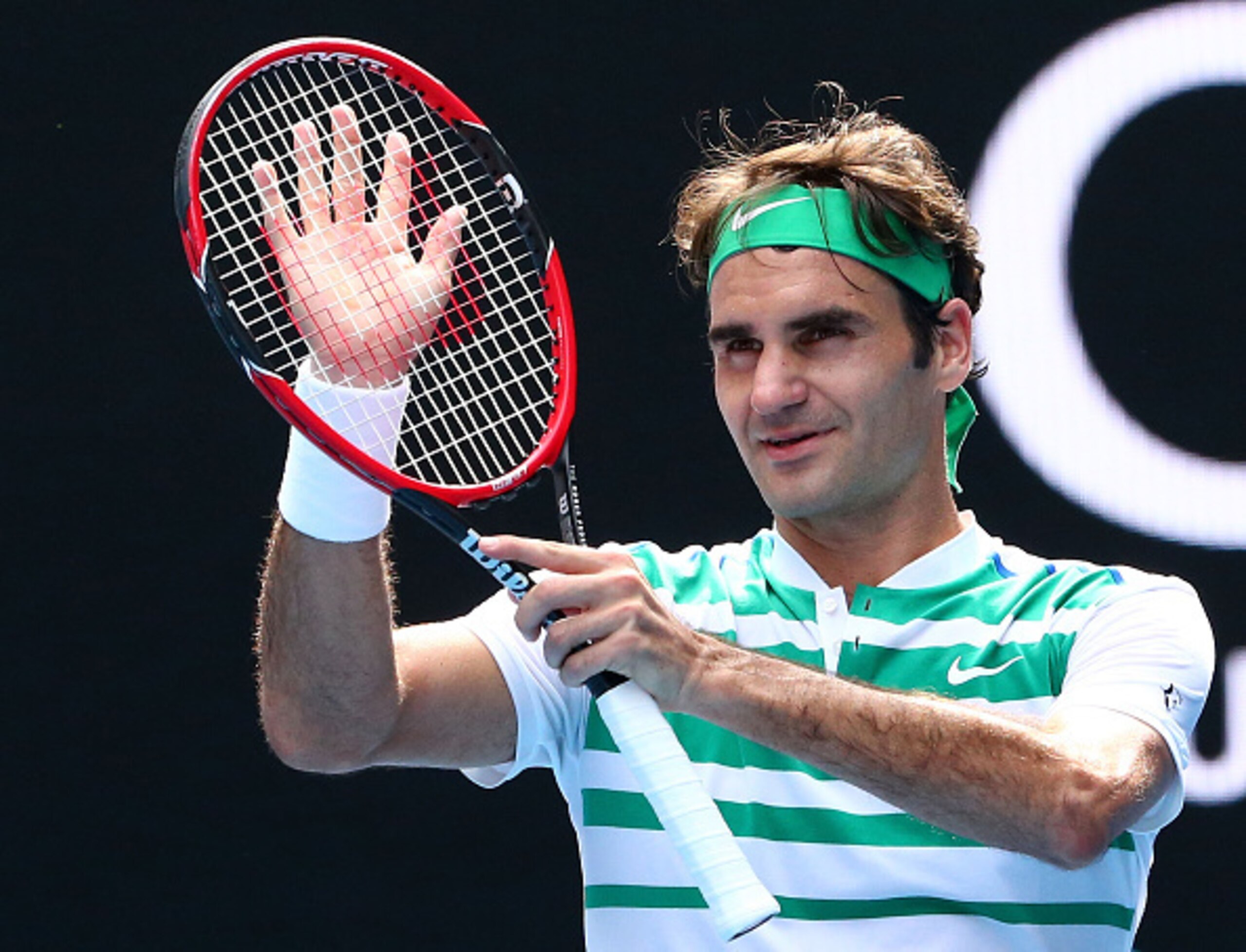 Roger Federer applauds his win over Tomas Berdych in the quarterfinals of the 2016 Australian Open.