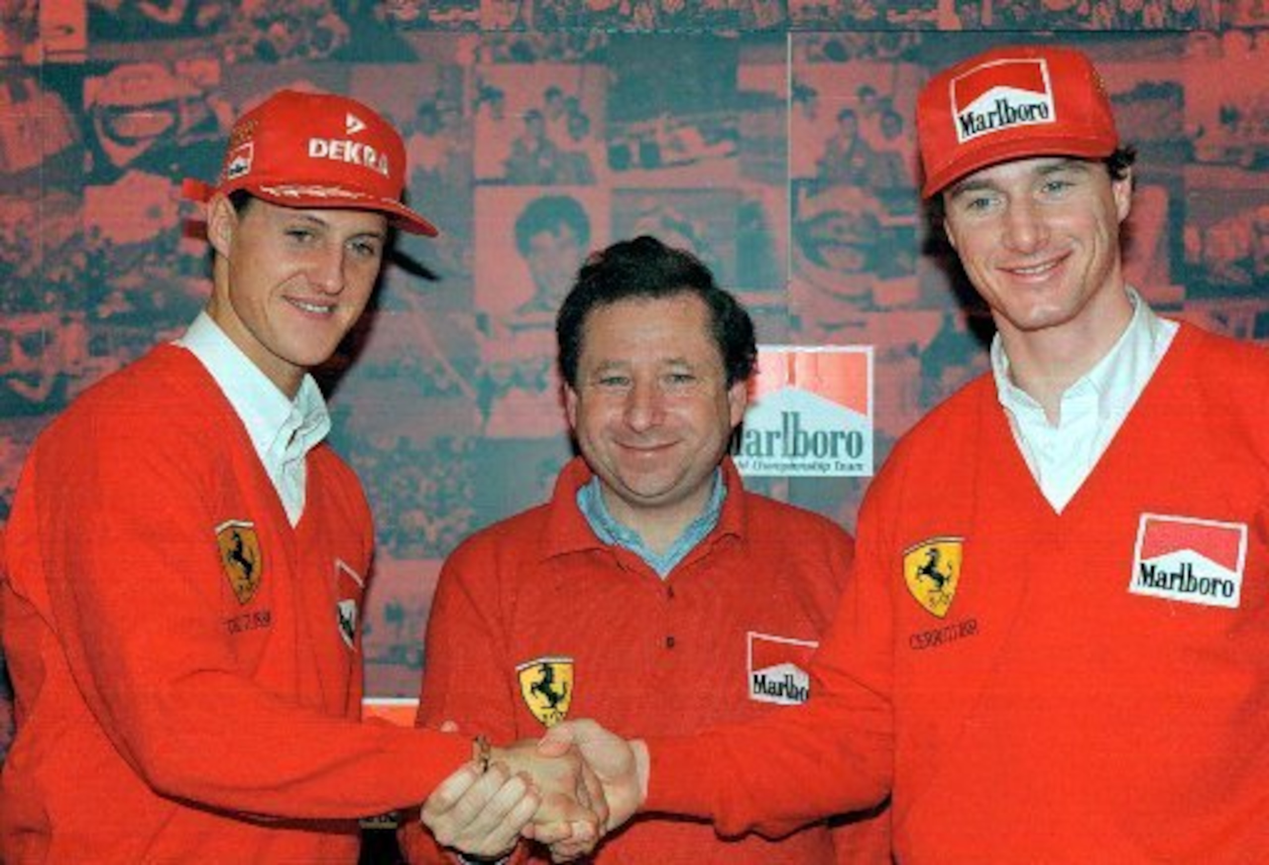 Michael Schumacher with team boss Jean Todt and 1996 team-mate Eddie Irvine.