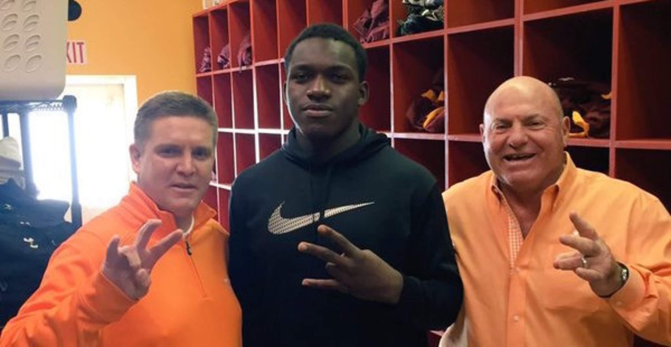 Jonathan Kongbo (center) with new UT defensive coordinator Bob Shoop (left) and Steve Stripling (right).