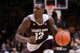 Jan 9, 2016; Knoxville, TN, USA; Texas A&M Aggies guard Jalen Jones (12) brings the ball up court against the Tennessee Volunteers during the second half at Thompson-Boling Arena. Texas won 92 to 88. Mandatory Credit: Randy Sartin-USA TODAY Sports