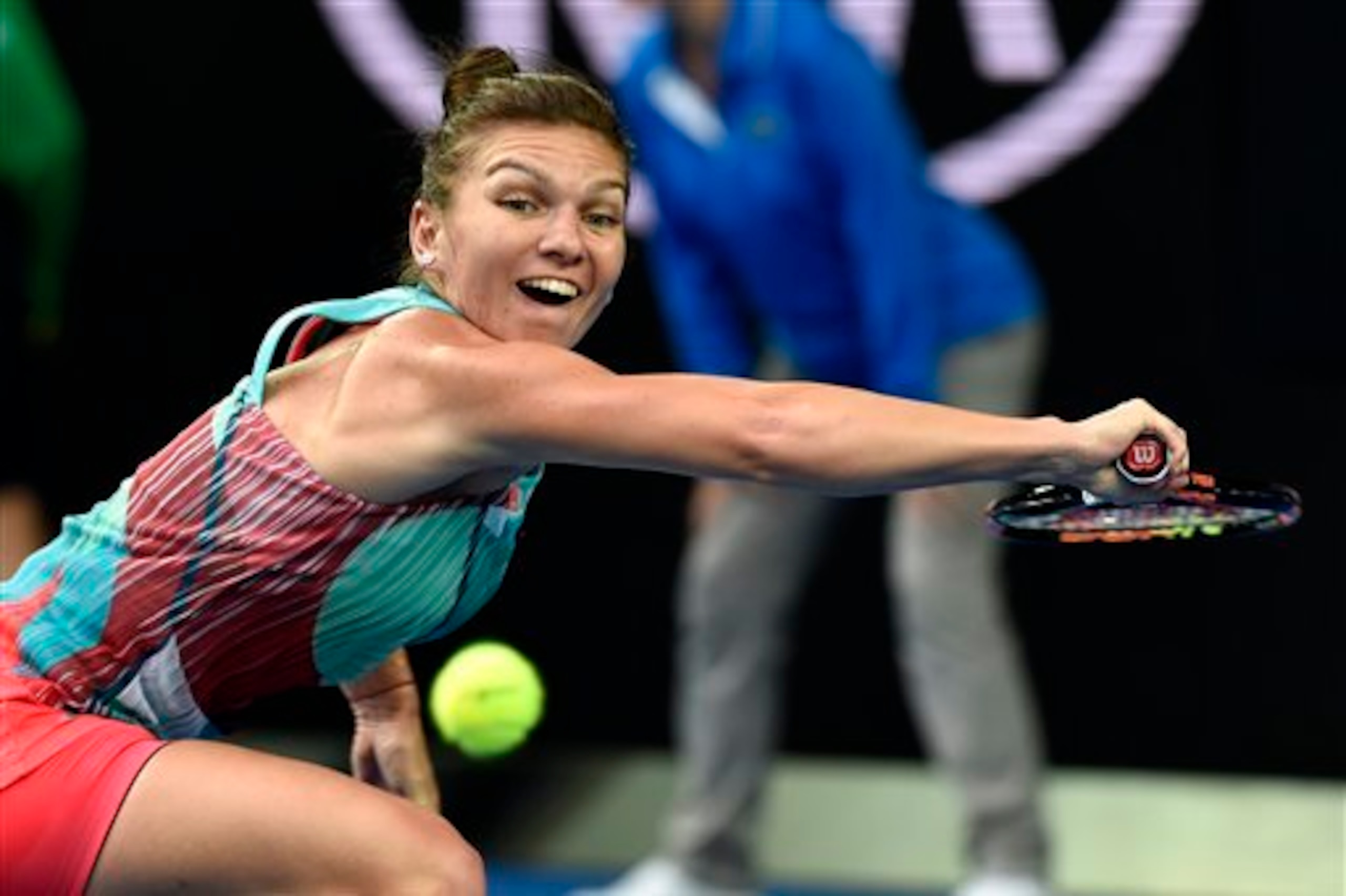 Simona Halep attempts a backhand slice during her first-round match at the 2016 Australian Open.