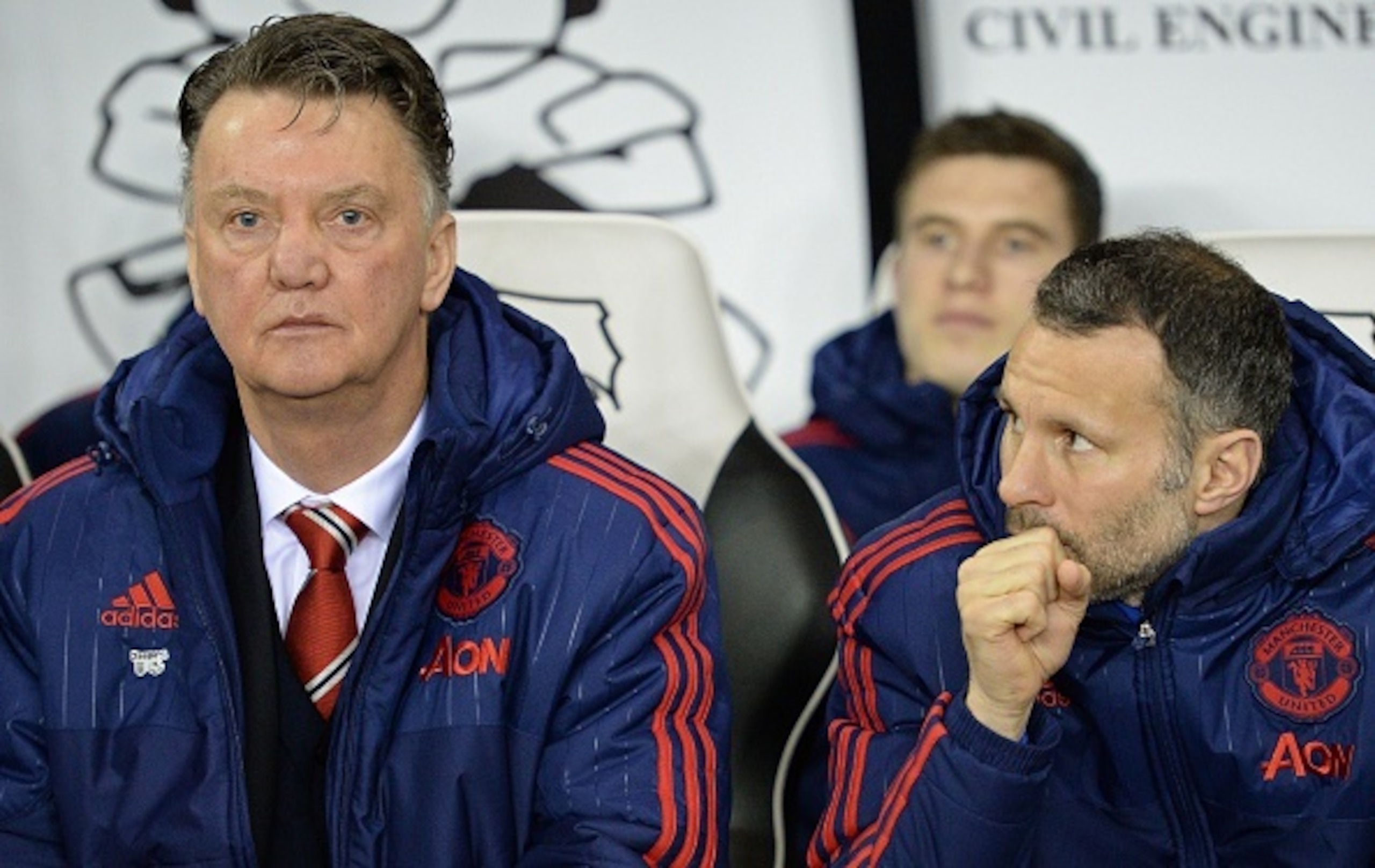 Manchester United's Welsh assistant manager Ryan Giggs (R) looks towards Manchester United's Dutch manager Louis van Gaal ahead of the FA cup fourth round football match between Derby County and Manchester United at Pride Park stadium in Derby on January Manchester United's Welsh assistant manager Ryan Giggs (R) looks towards Manchester United's Dutch manager Louis van Gaal ahead of the FA cup fourth round football match between Derby County and Manchester United at Pride Park stadium in Derby on January