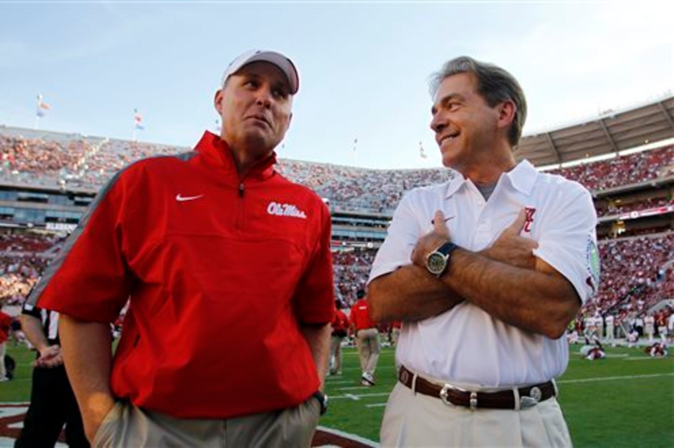 Ole Miss coach Hugh Freeze, left, and Alabama head coach Nick Saban are set to sign top-tier recruiting classes.