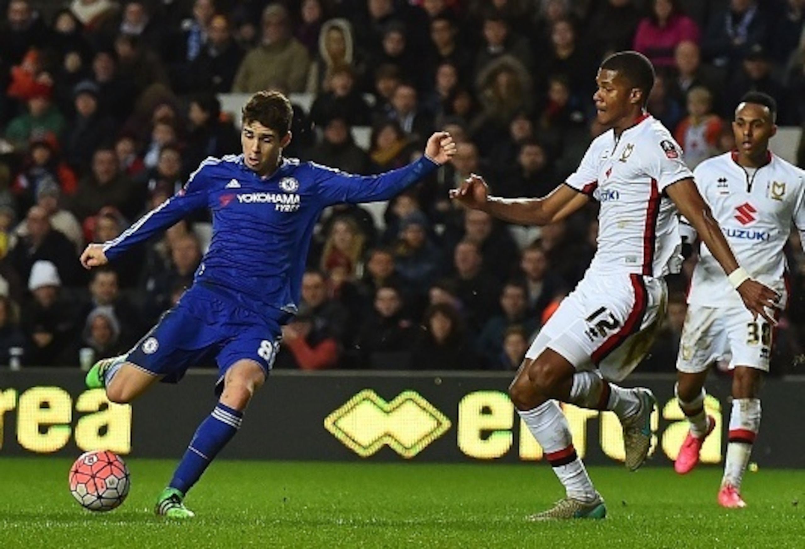 Oscar picks his spot as he curls home his third goal of the game.