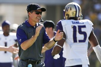 Washington head coach Chris Petersen (left)